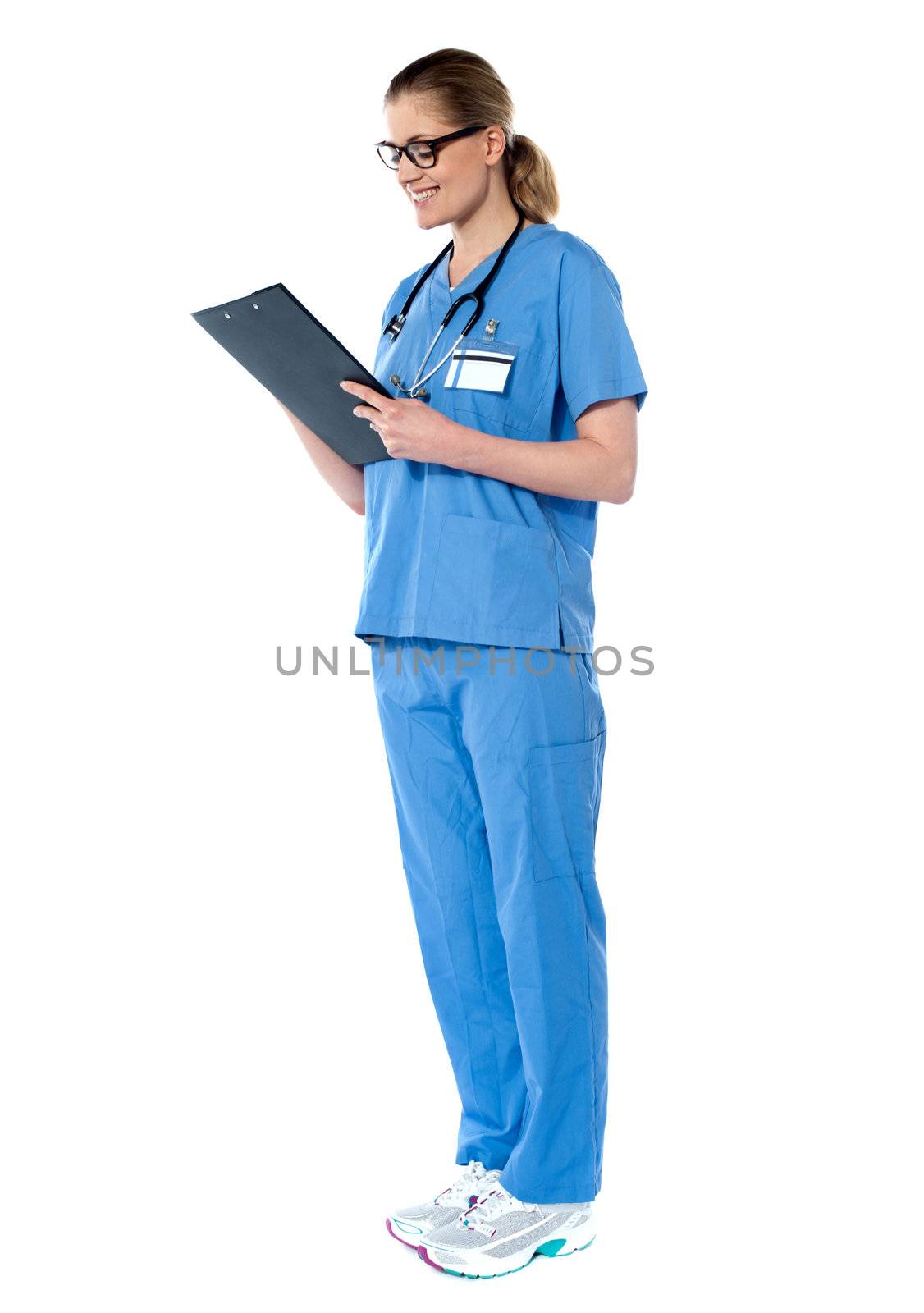 Female surgeon looking at reports isolated on white background