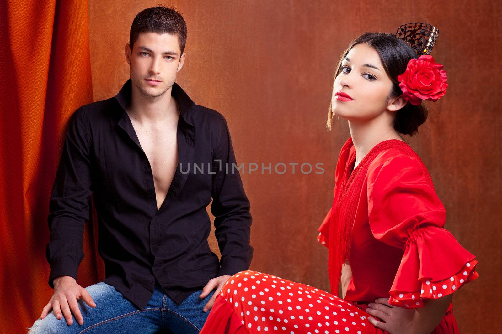 Gipsy flamenco dancer couple from Spain with red rose and spanish back comb peineta