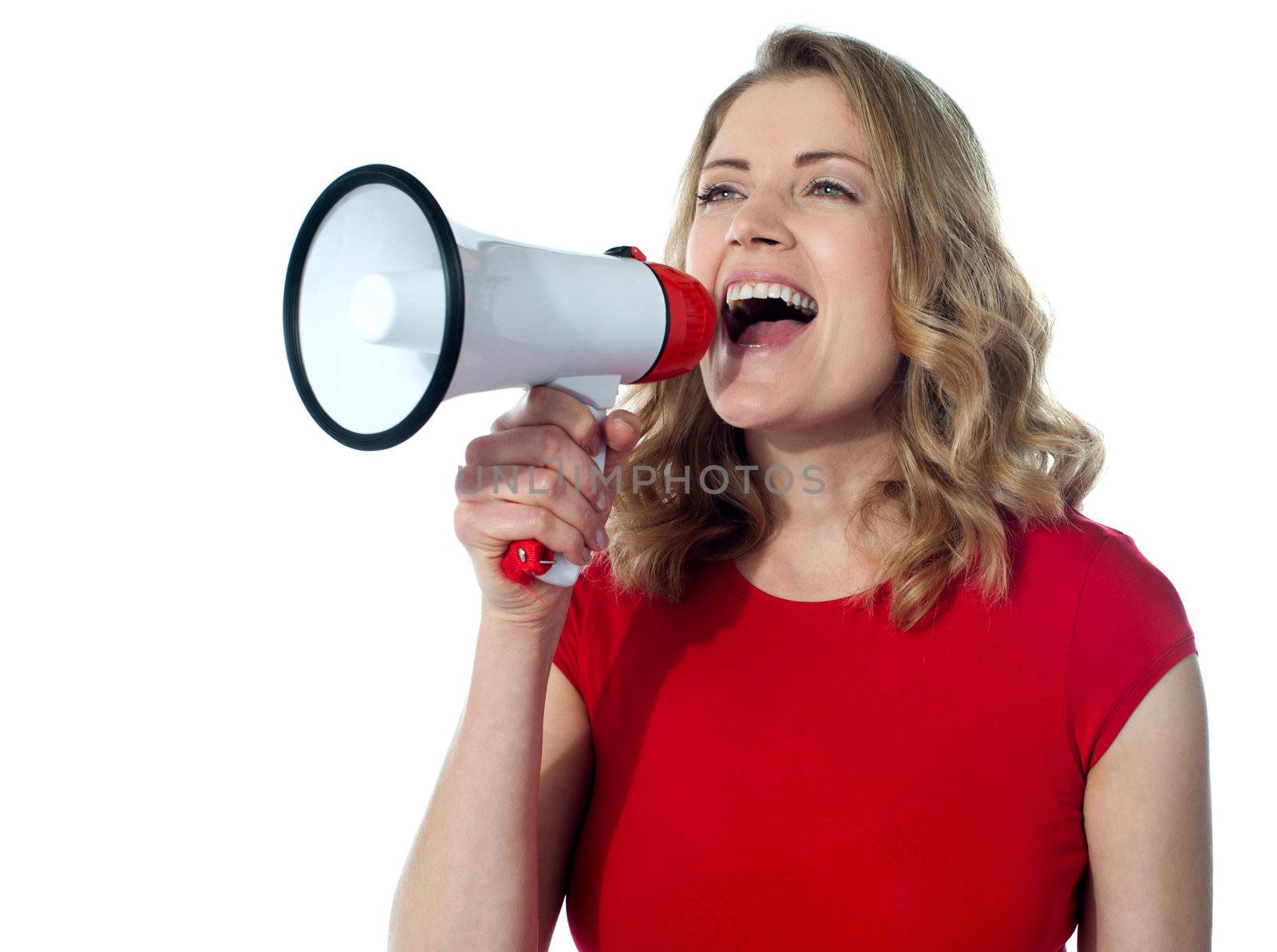 Gorgeous female speaking loudly through megaphone
