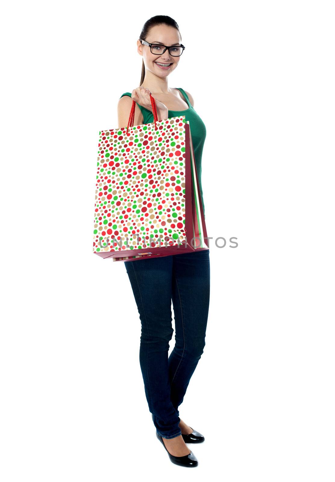 Stunning young woman carrying shopping bags
