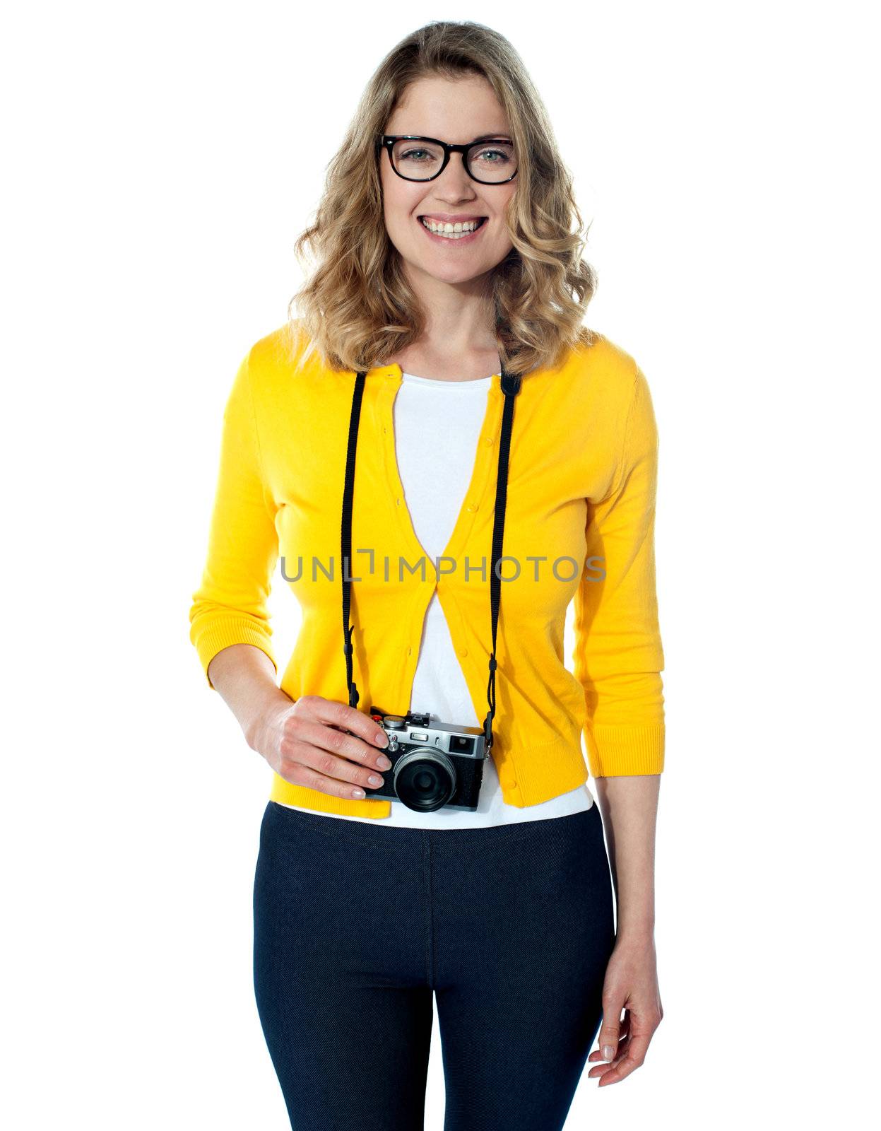 Attractive young girl with a camera over white background