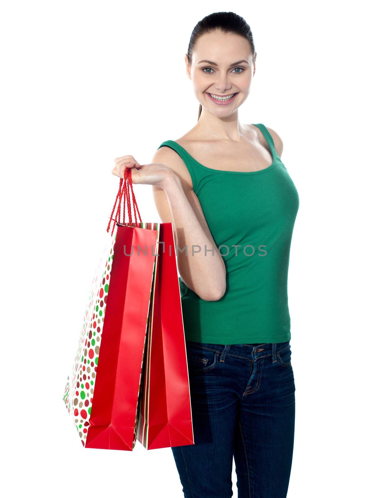 Woman holding shopping bags against white background