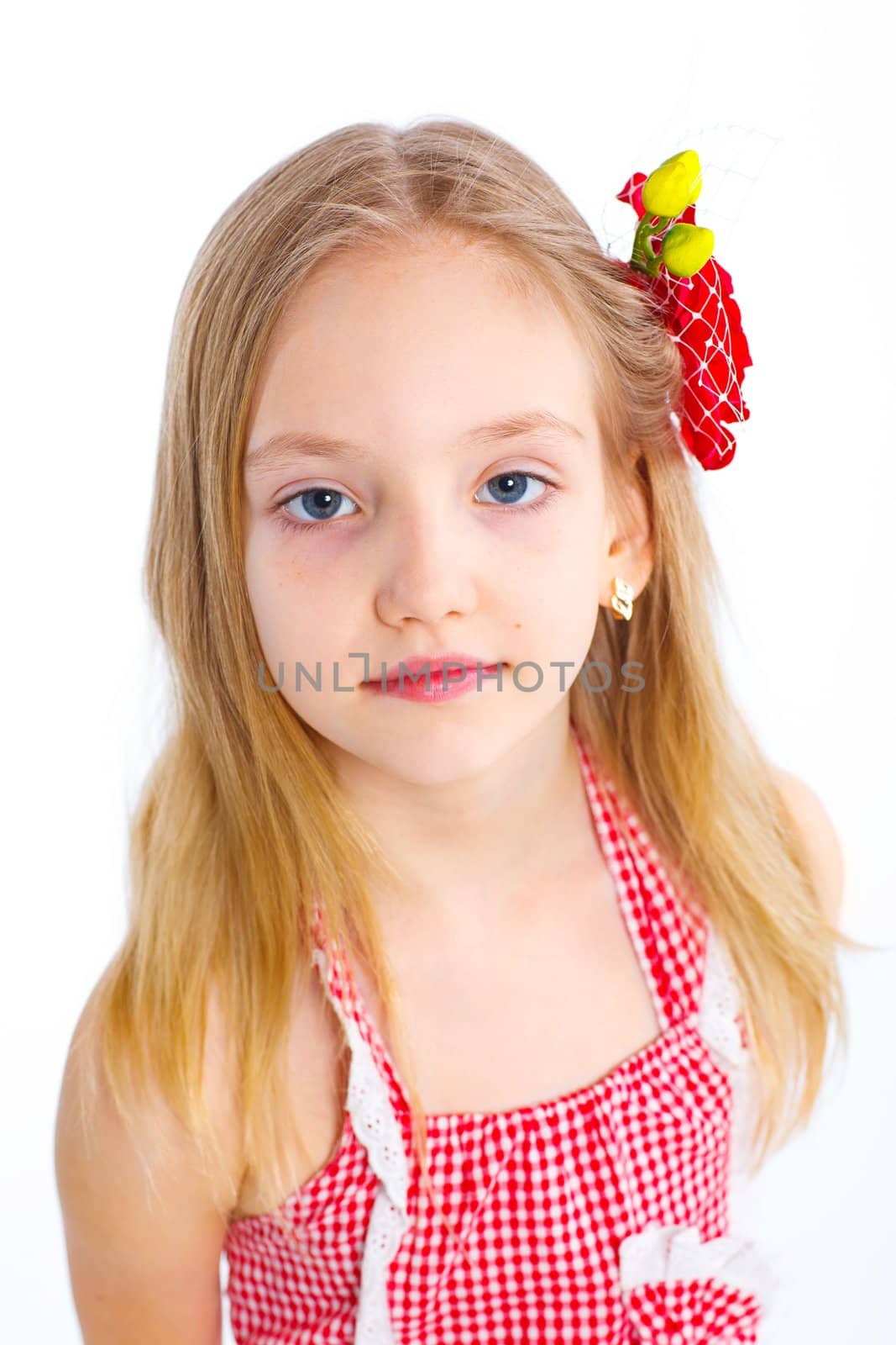Portrait of cute little girl in red clothes on white background