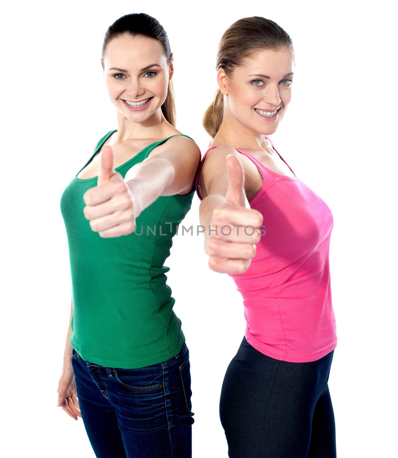 Smiling pretty girls gesturing thumbs-up isolated on white background