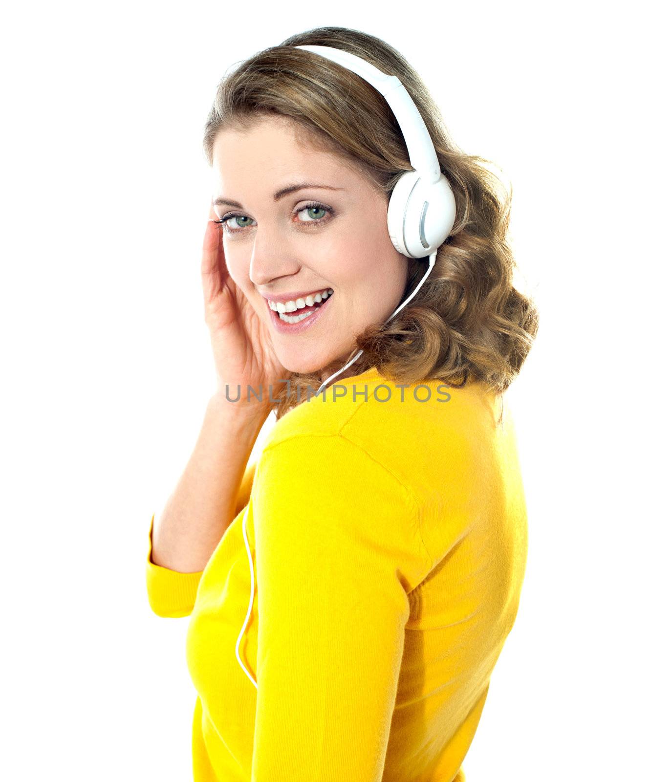 Attractive teenager tuned into music on her mp3 player