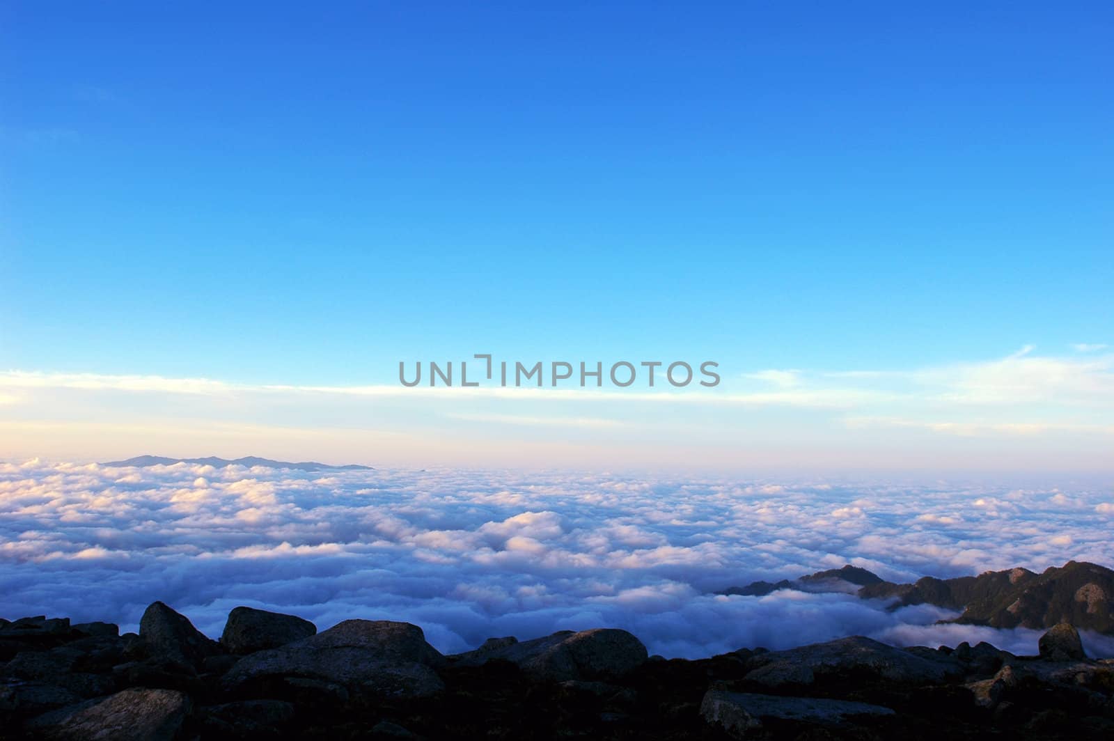 Cloudscape on the top of the mountains at sunrise