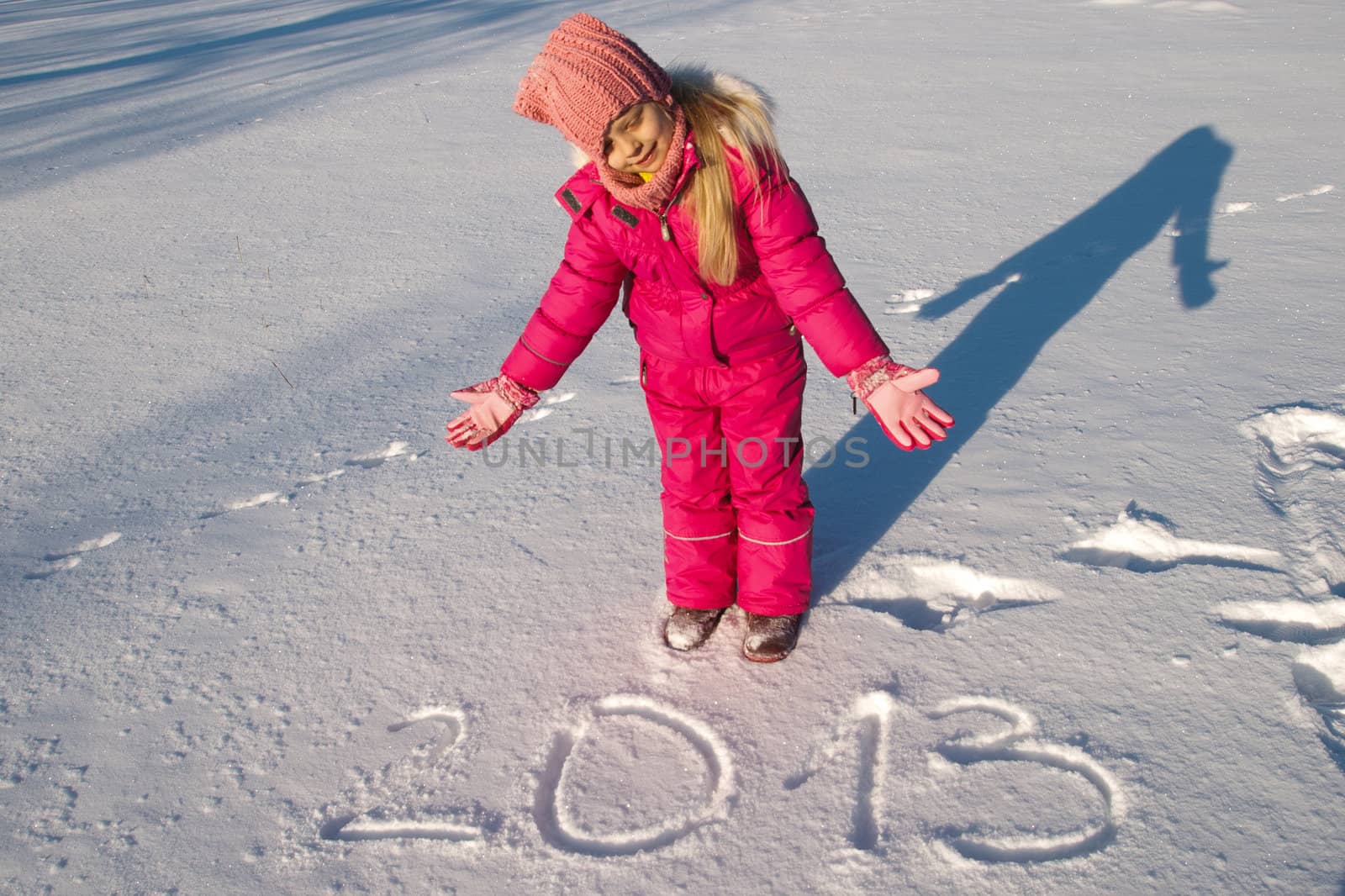 a little girl and in the snow hand written message 2013