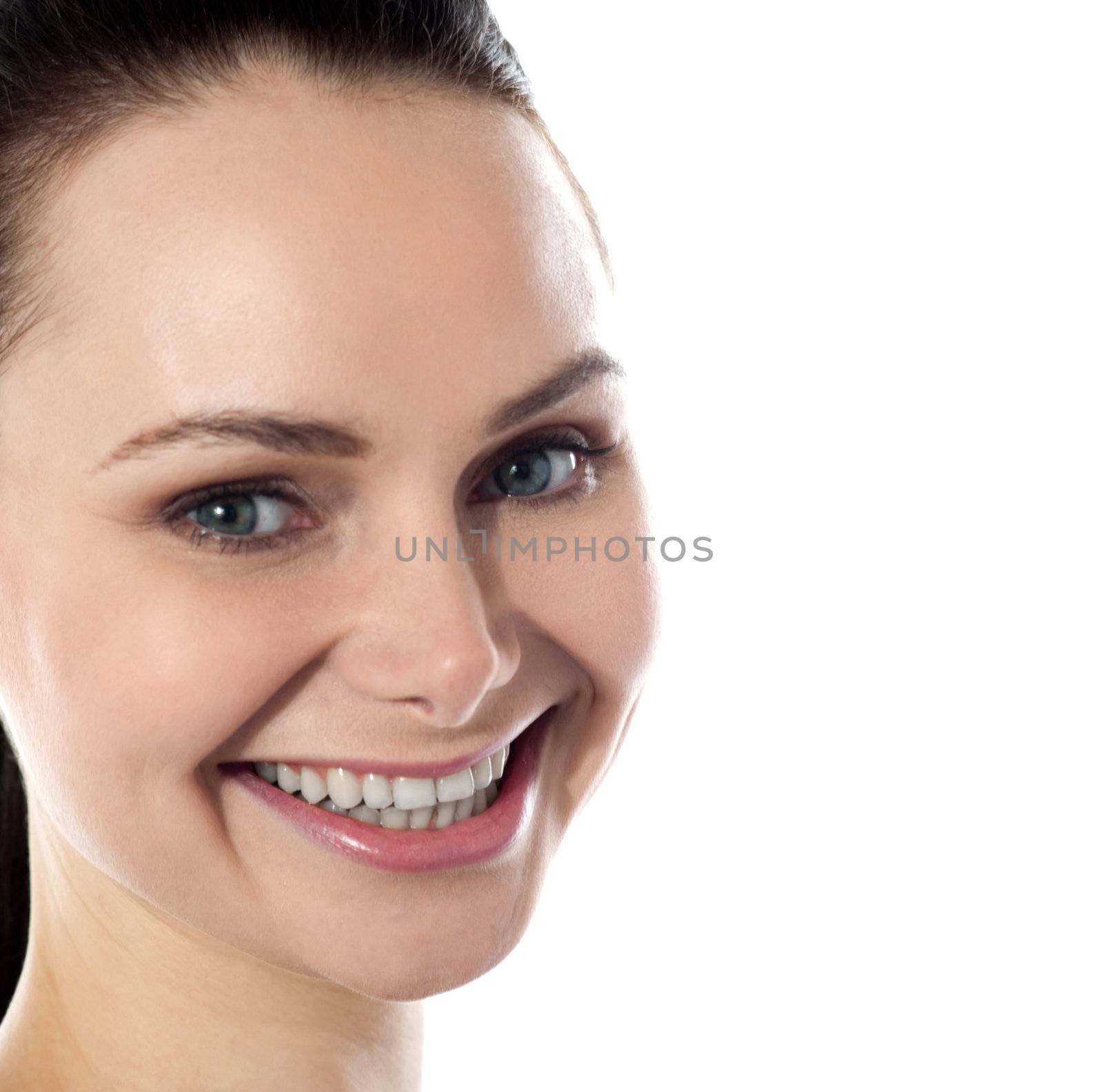 Attractive young woman looking at you. Isolated background