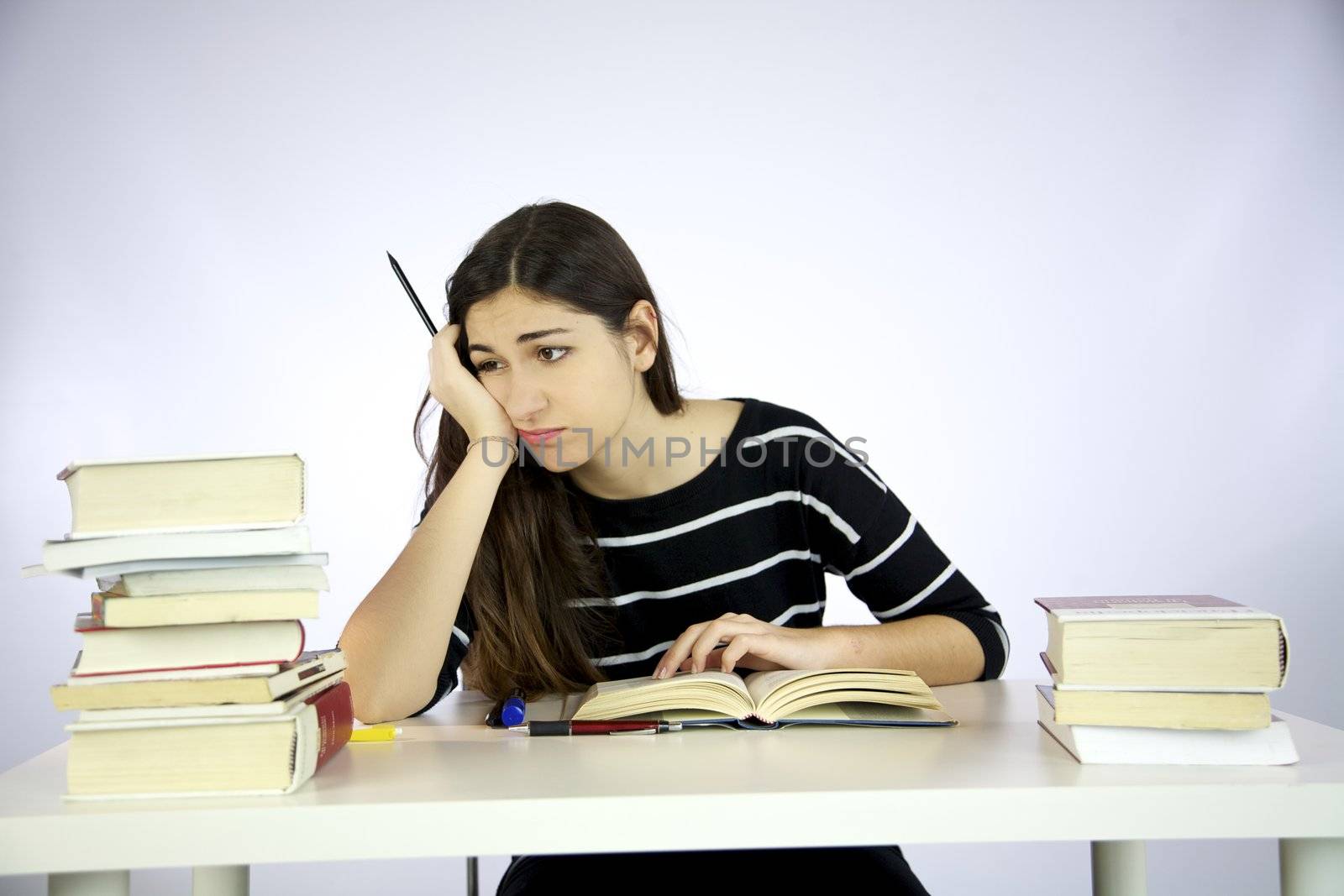 Girl studying unhappy and depressed
 by fmarsicano