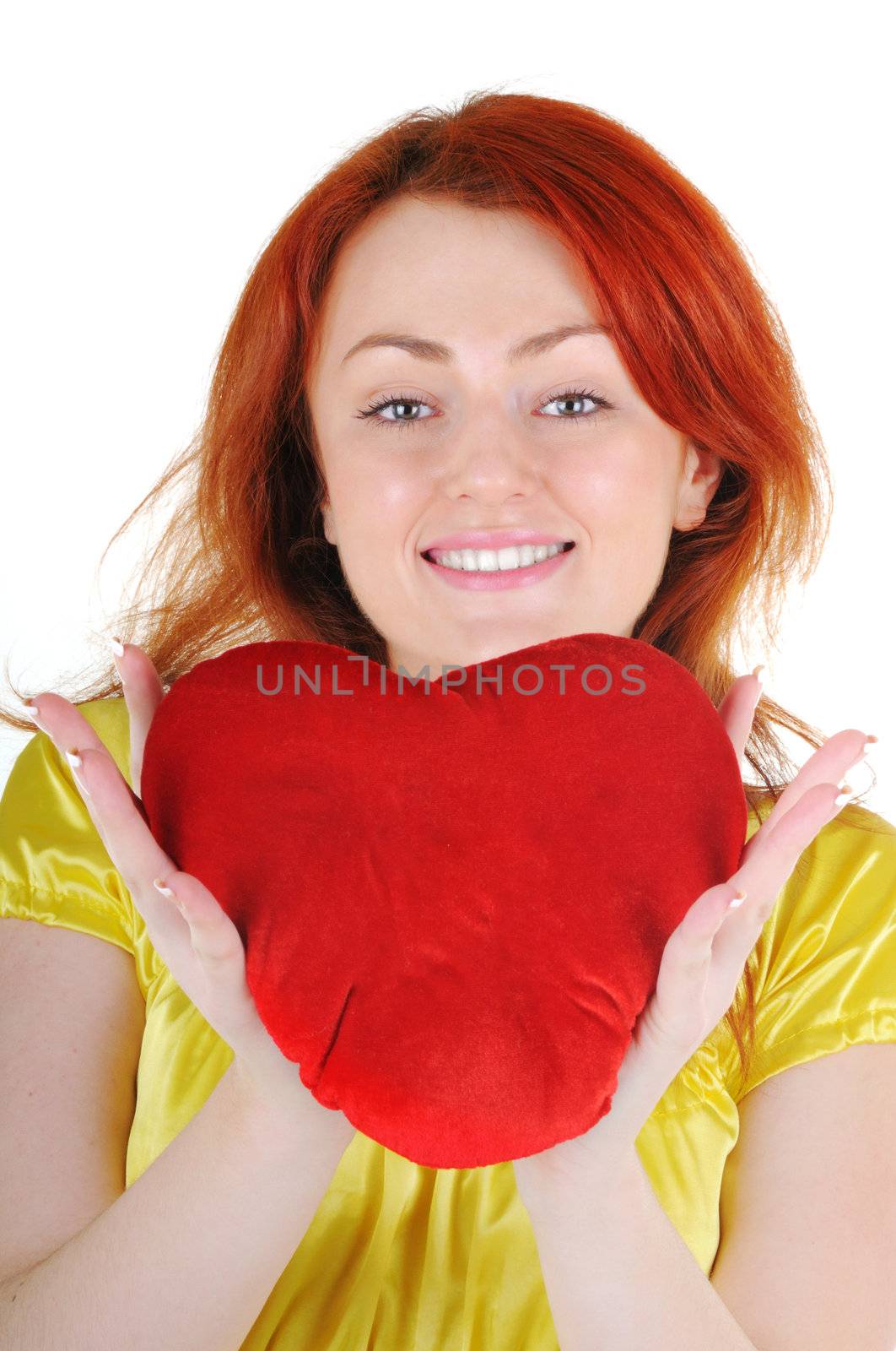 Young beautiul woman with red heart in her hands on white background. Focus on woman's eyes.