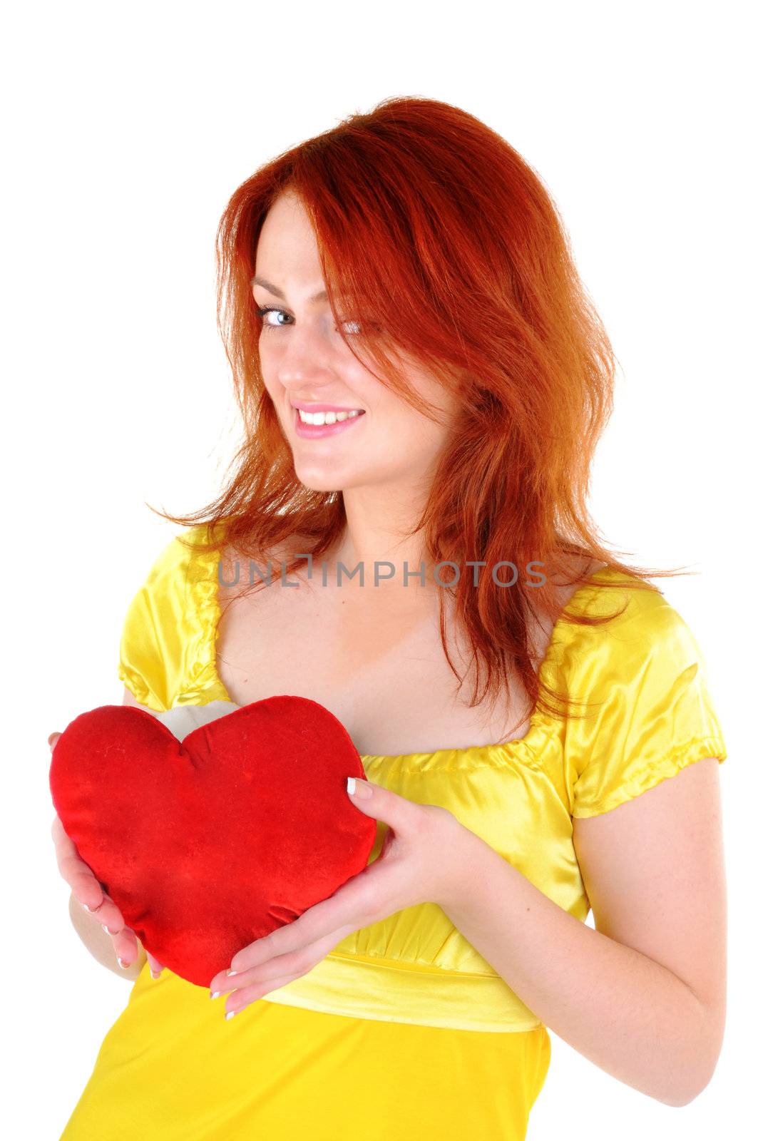 Young beautiul woman with red heart in her hands on white background. Focus on woman's eyes.