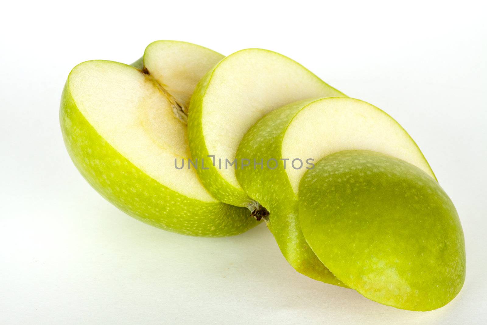 fresh green apple in four slices