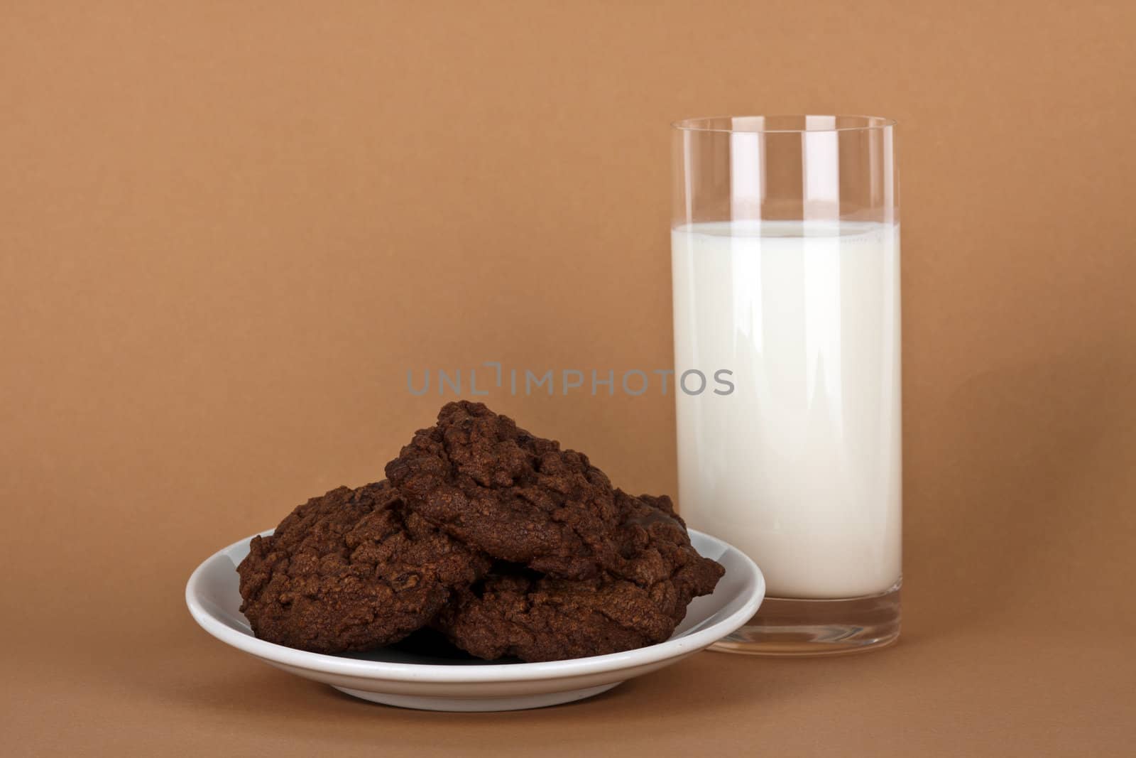 chocolate cookies with a glass of milk