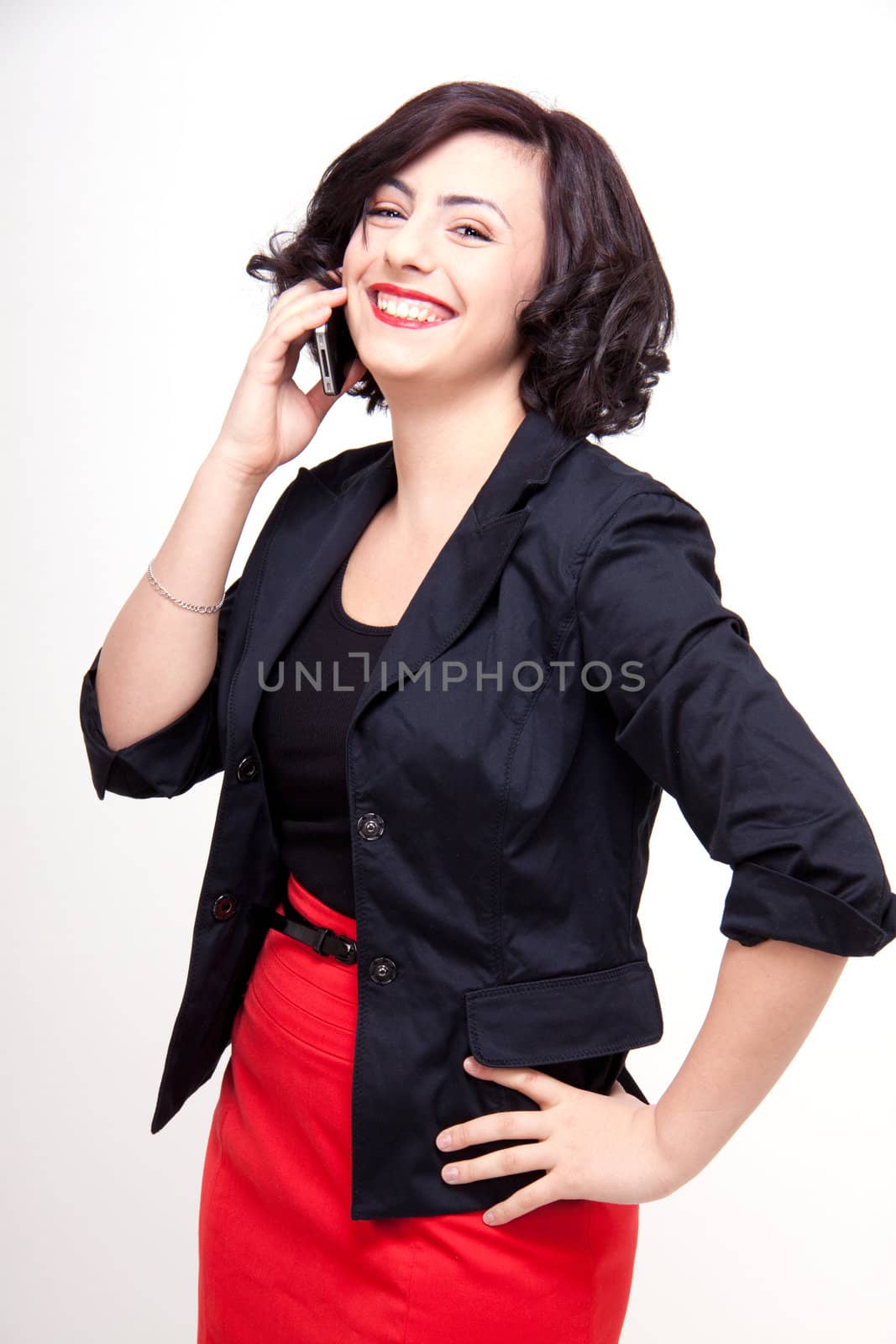 young business woman is talking on the mobile phone by juniart