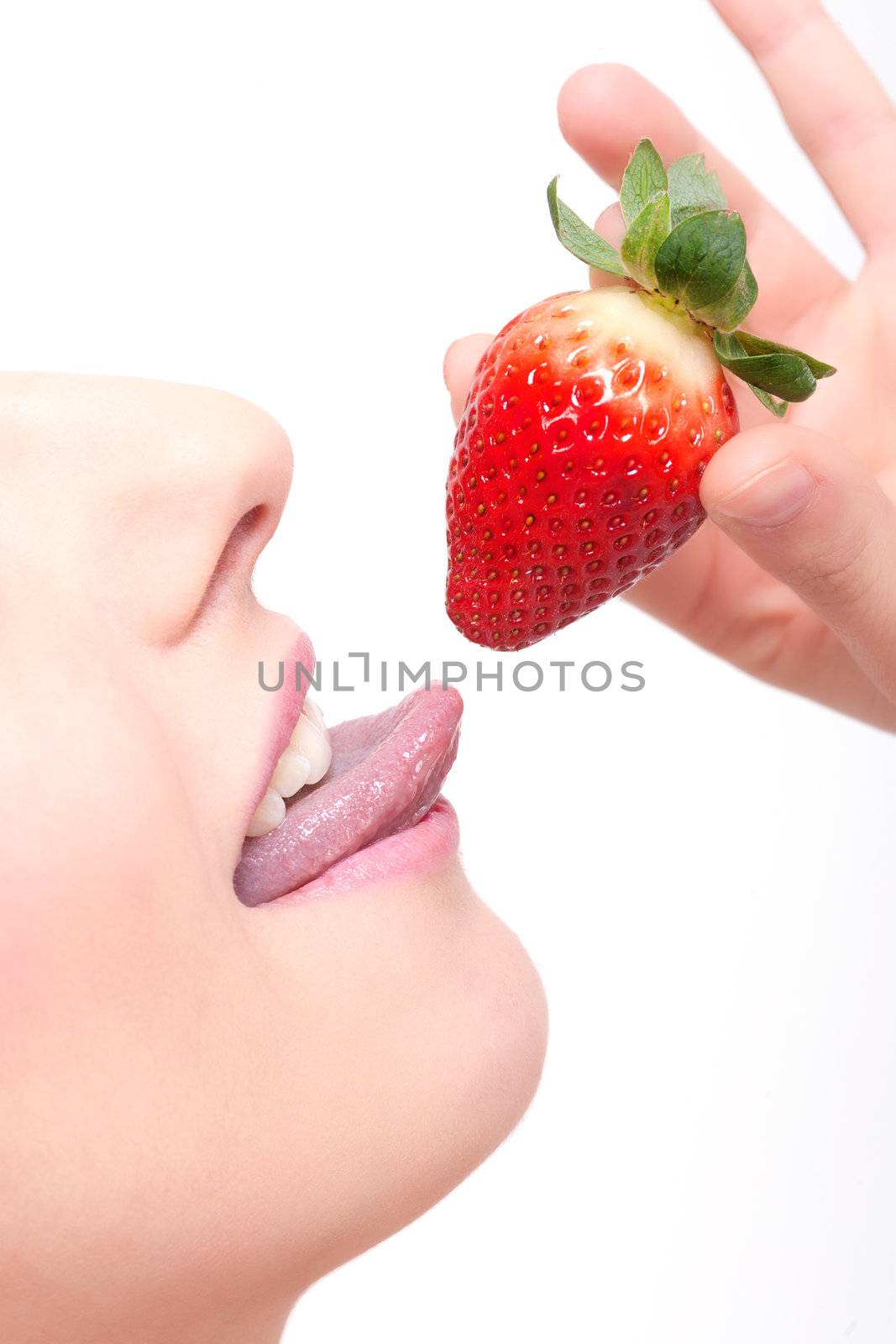 close-up woman�s lips and a strawberry