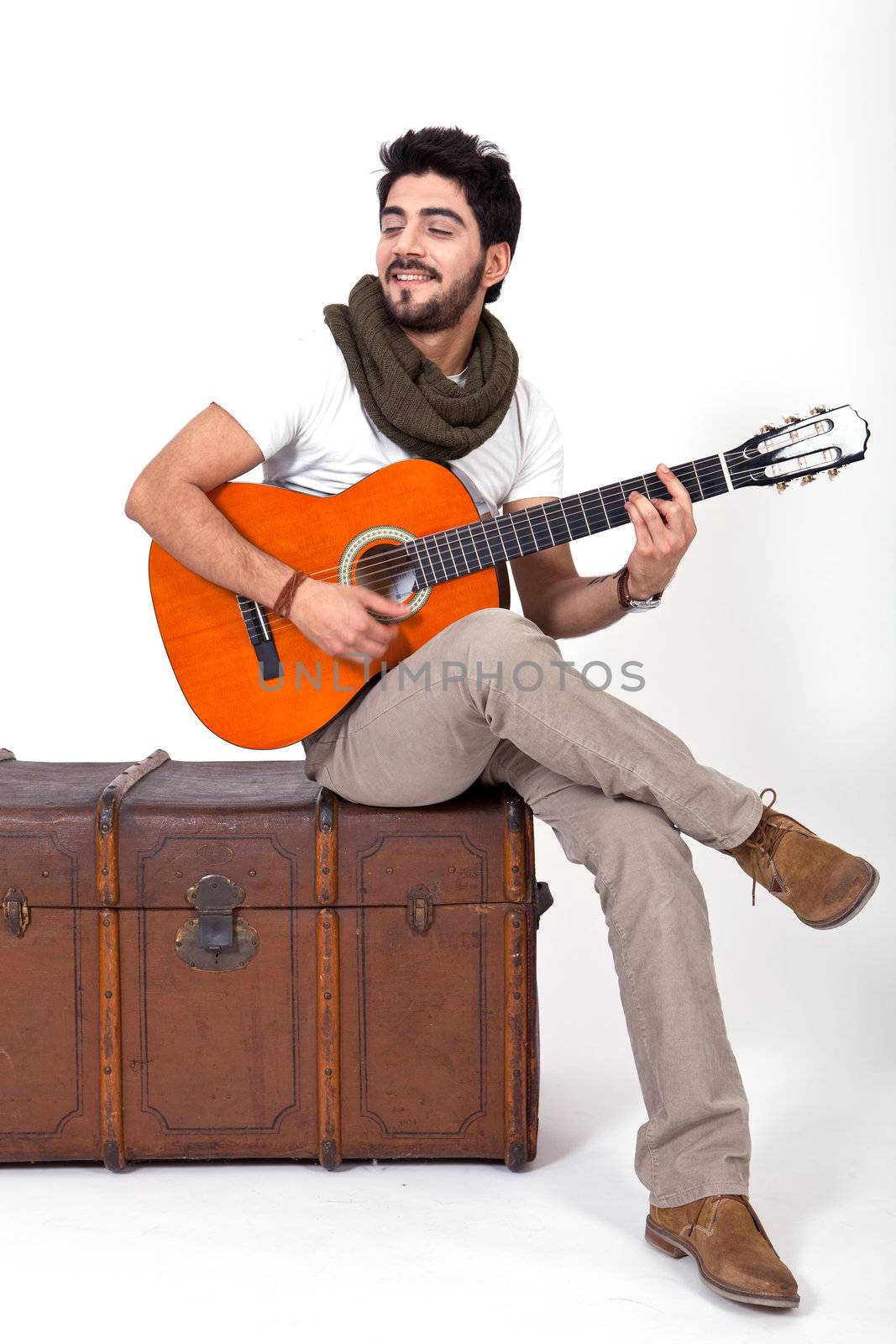 young man is playing a guitar and singing by juniart