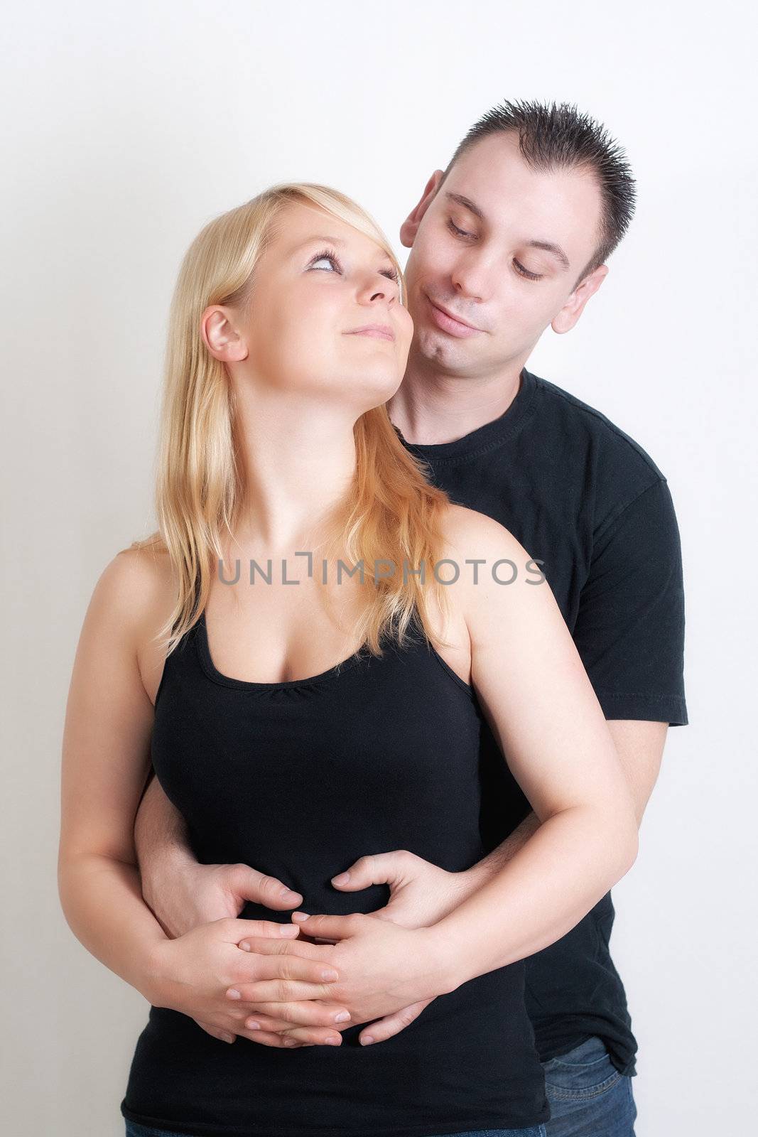 Portrait of cosy romantic couple hugging each other 