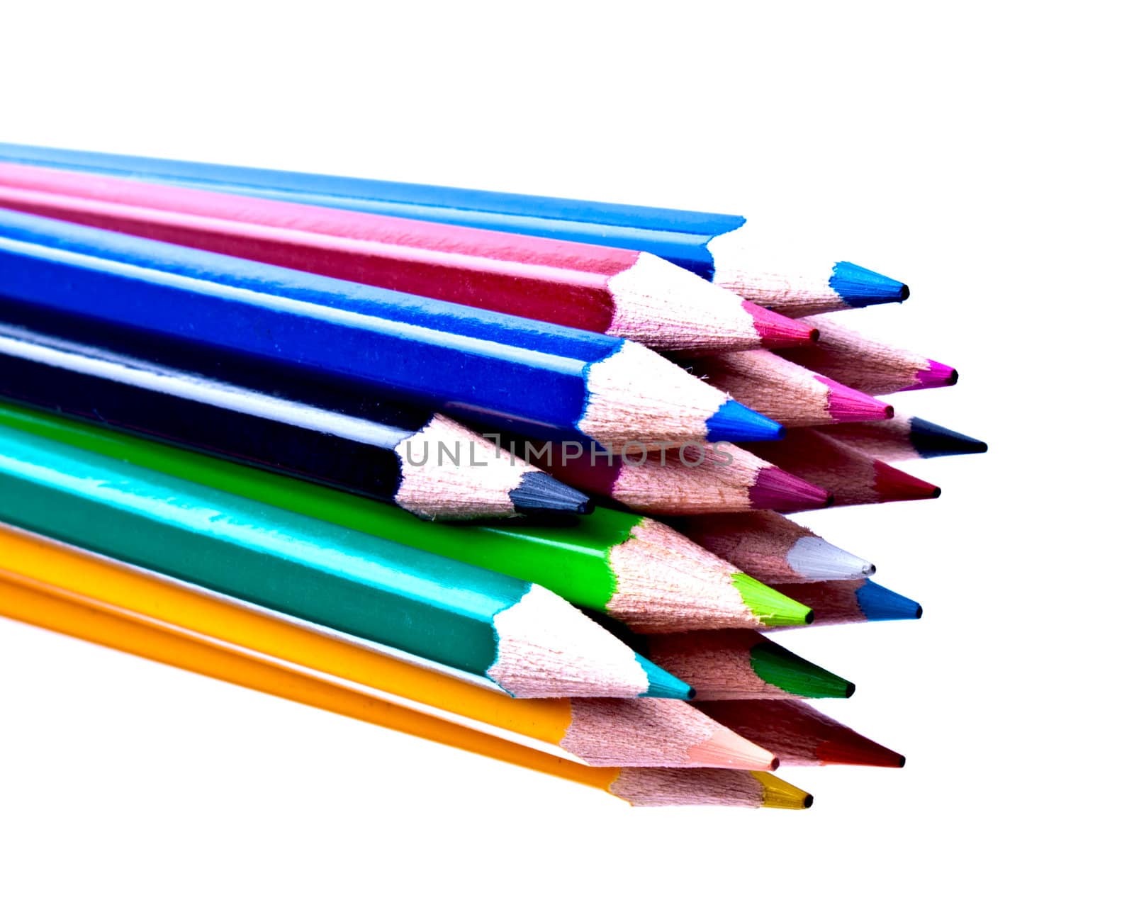 a bunch of colored pencils on a light background