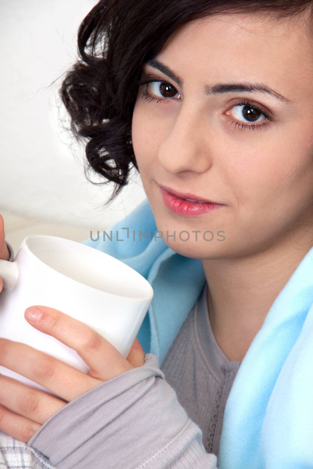 young beautiful girl with a cup of coffee