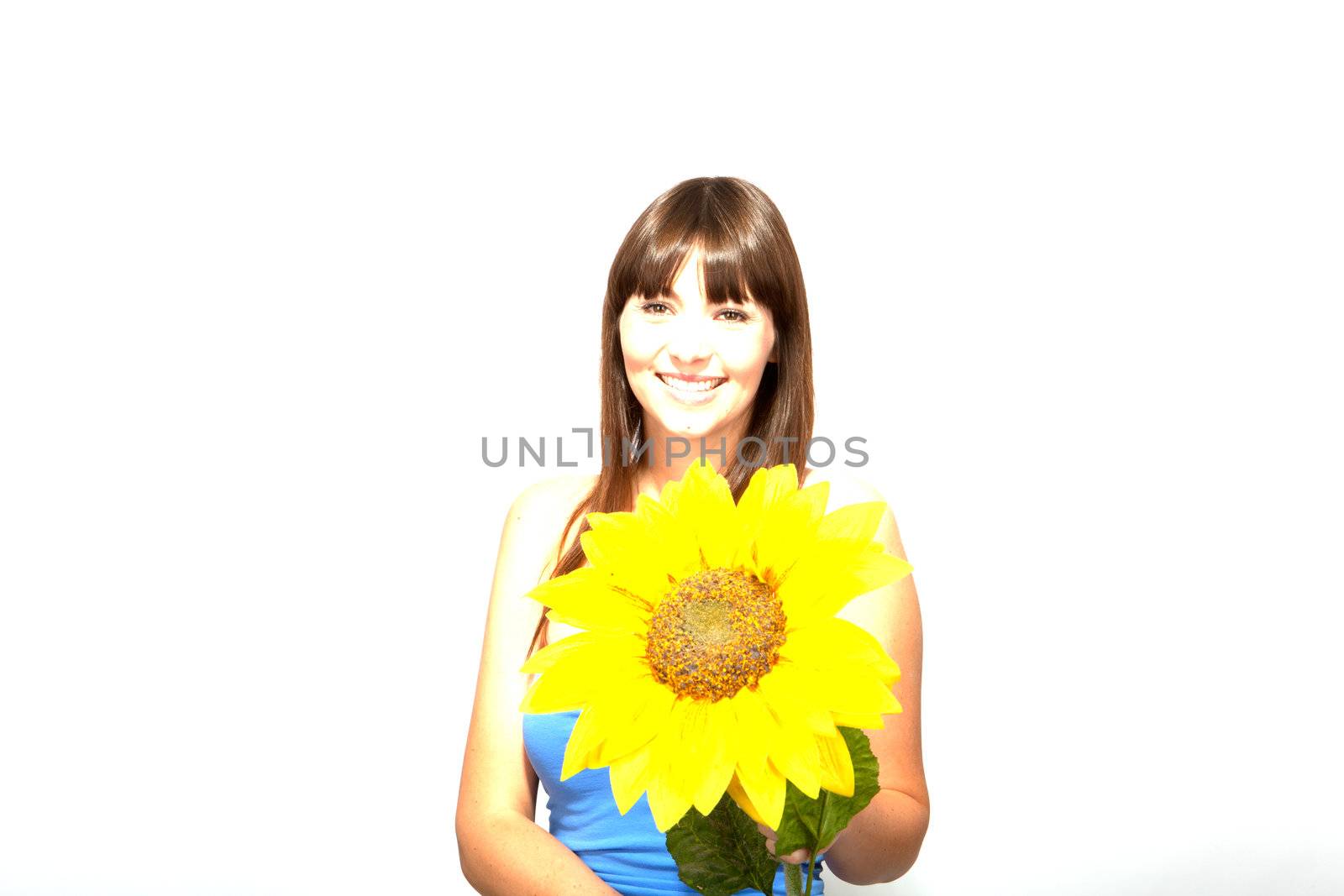 young beautiful brunette woman with a flower happy by juniart