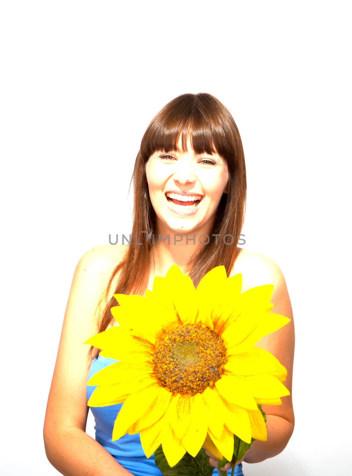 young beautiful brunette woman with a flower happy by juniart