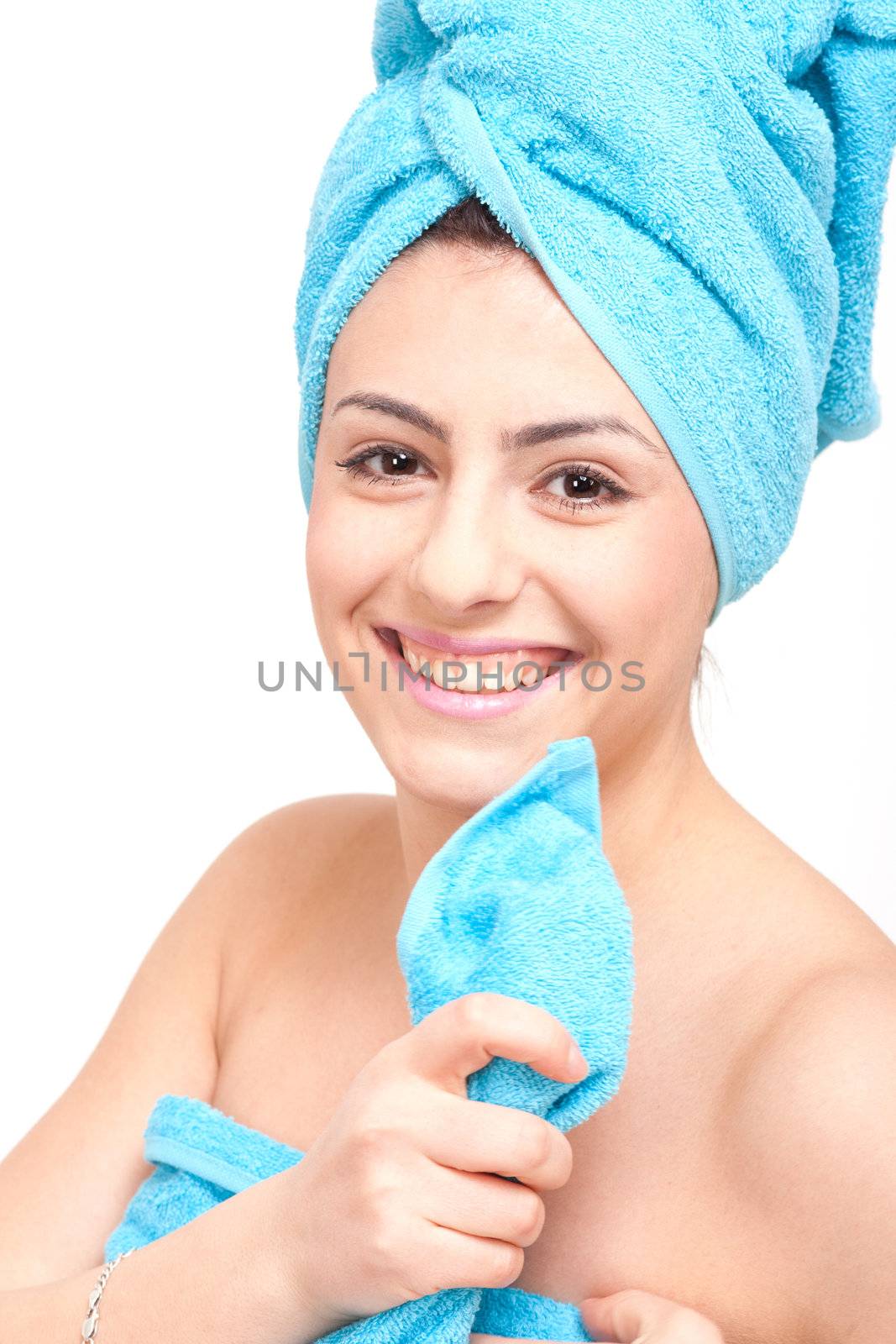 young beautiful woman with a towel doing wellness by juniart
