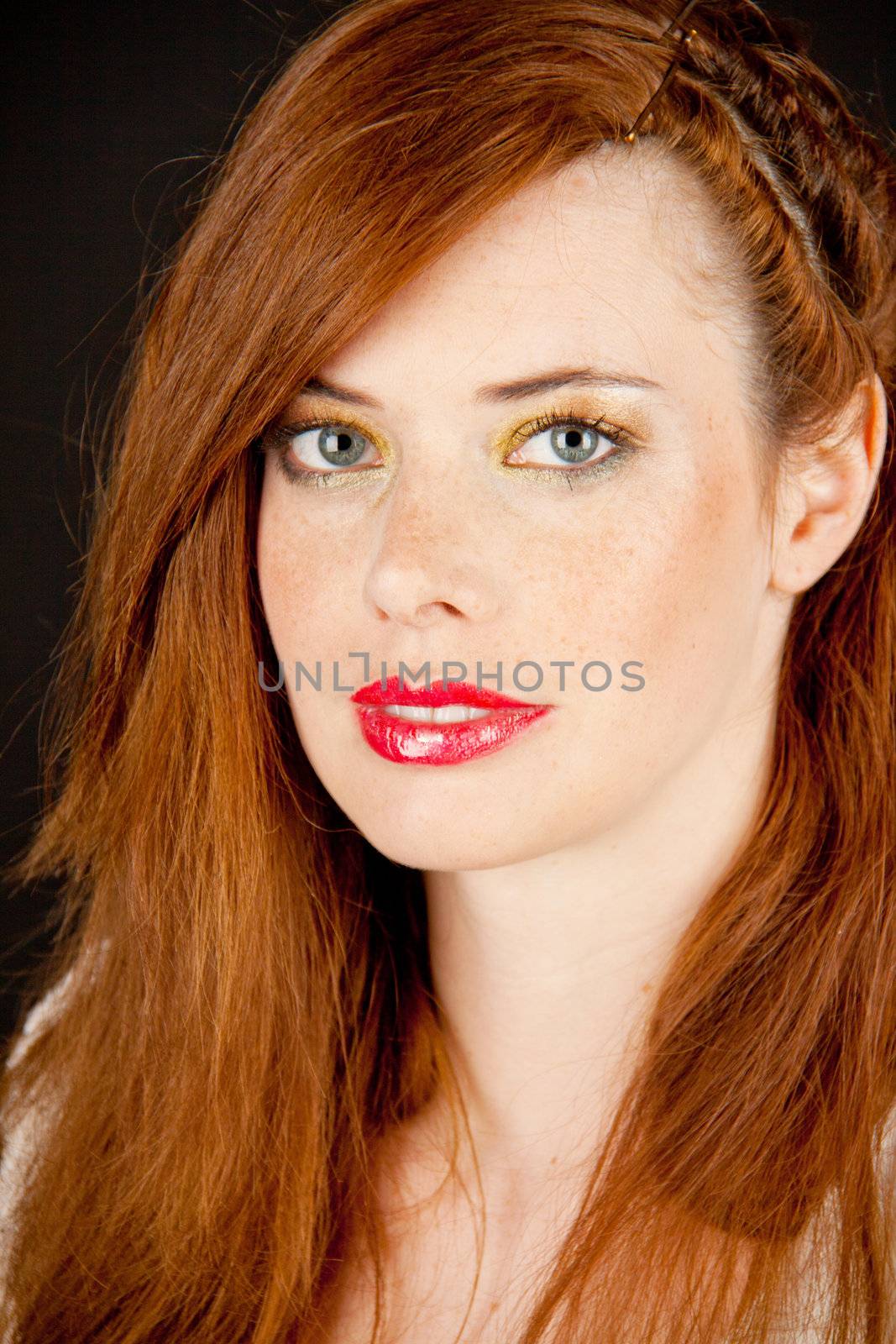 portrait of a beautiful young woman with red hair and red lips