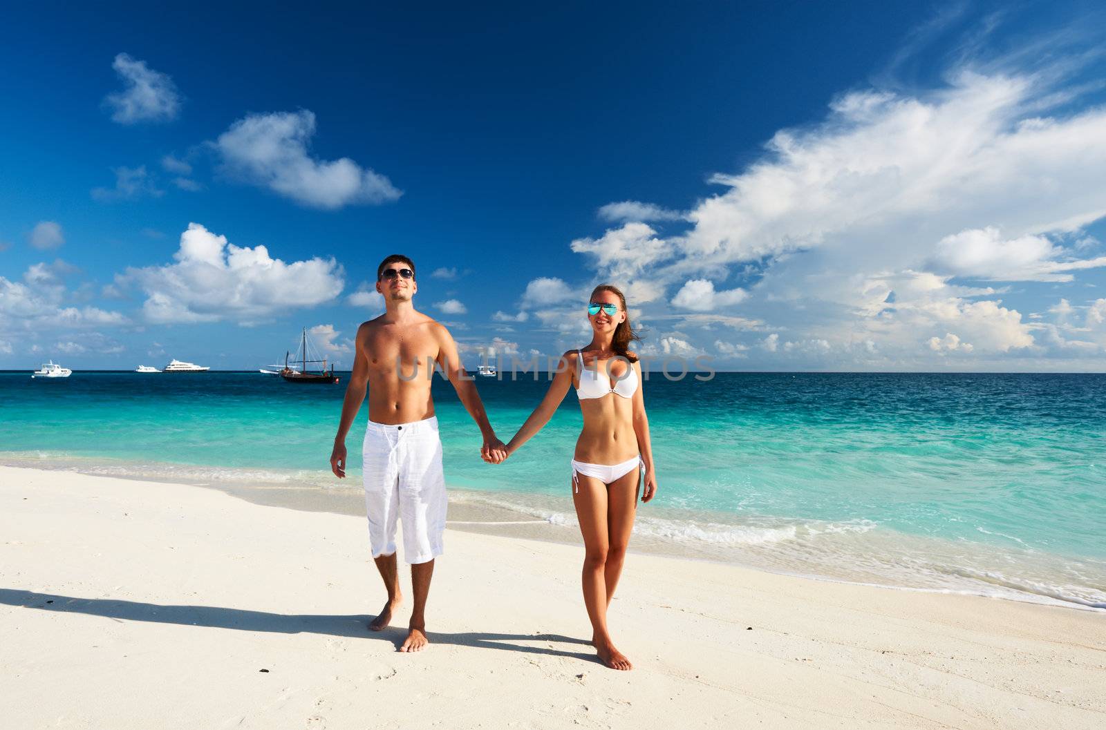 Couple on a tropical beach at Maldives