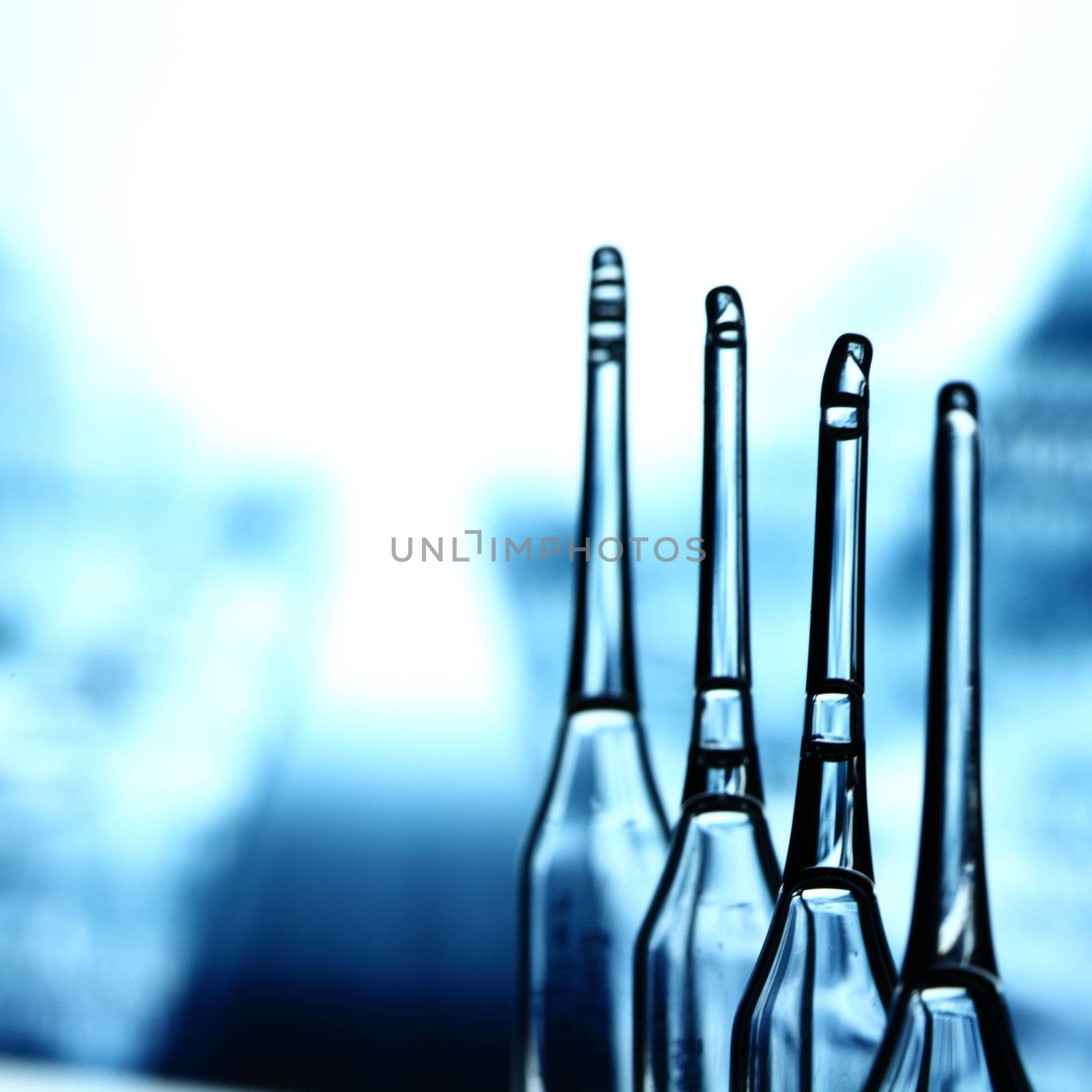 ampoule on abstract bokeh background