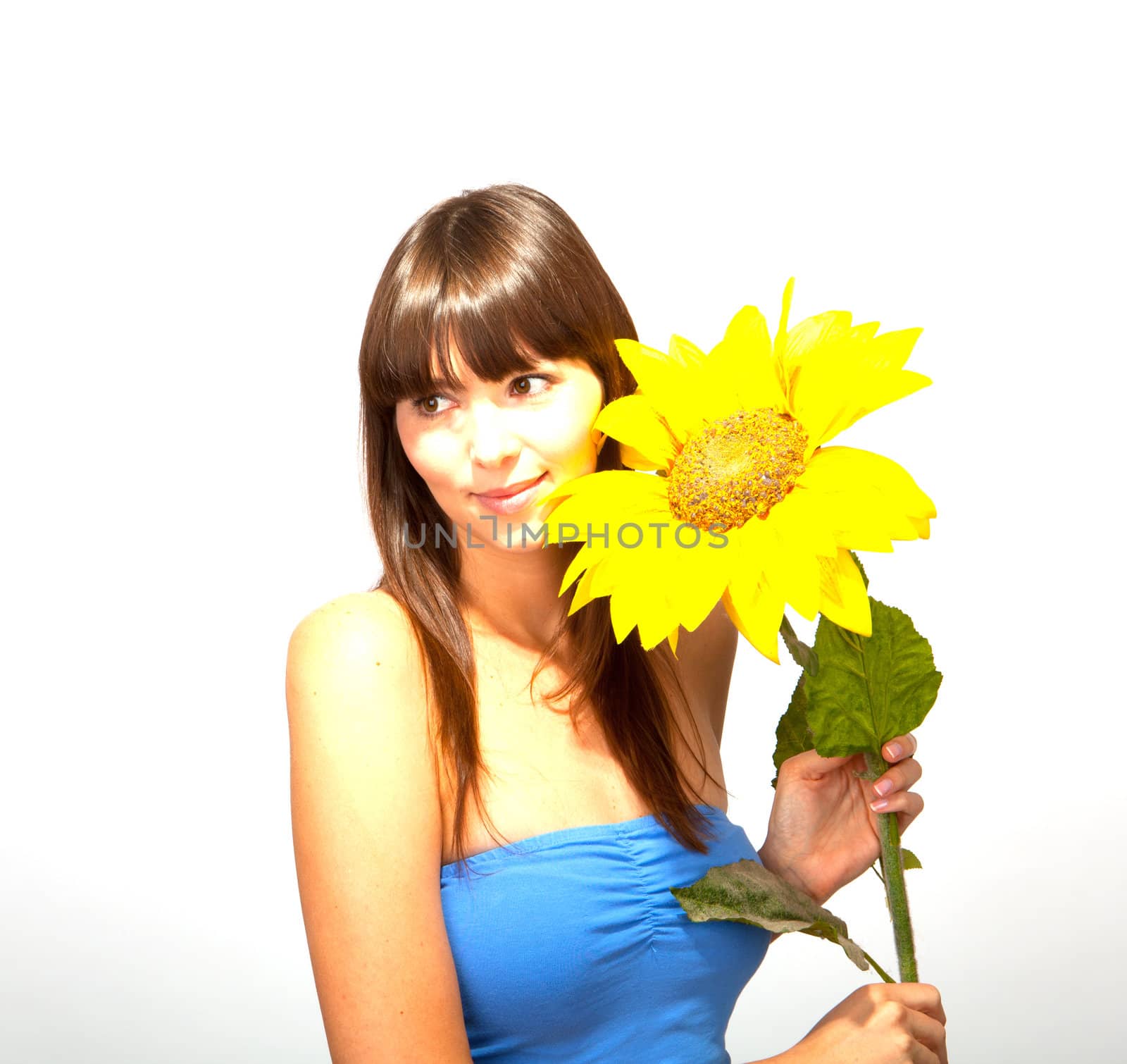 young beautiful brunette woman with a flower happy by juniart