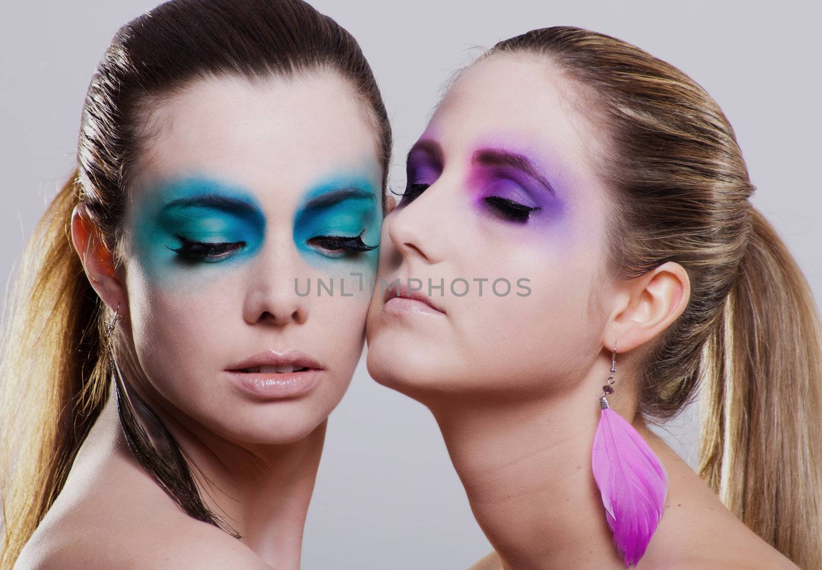 young beautiful woman with an extreme colorfull make up portrait by juniart