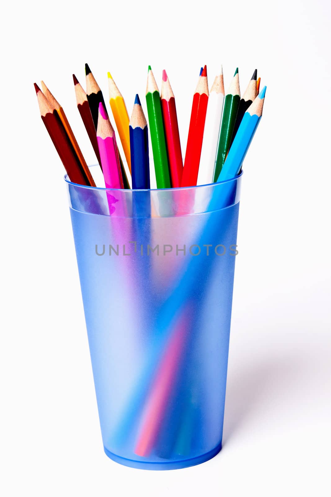 a bunch of colored pencils on a light background