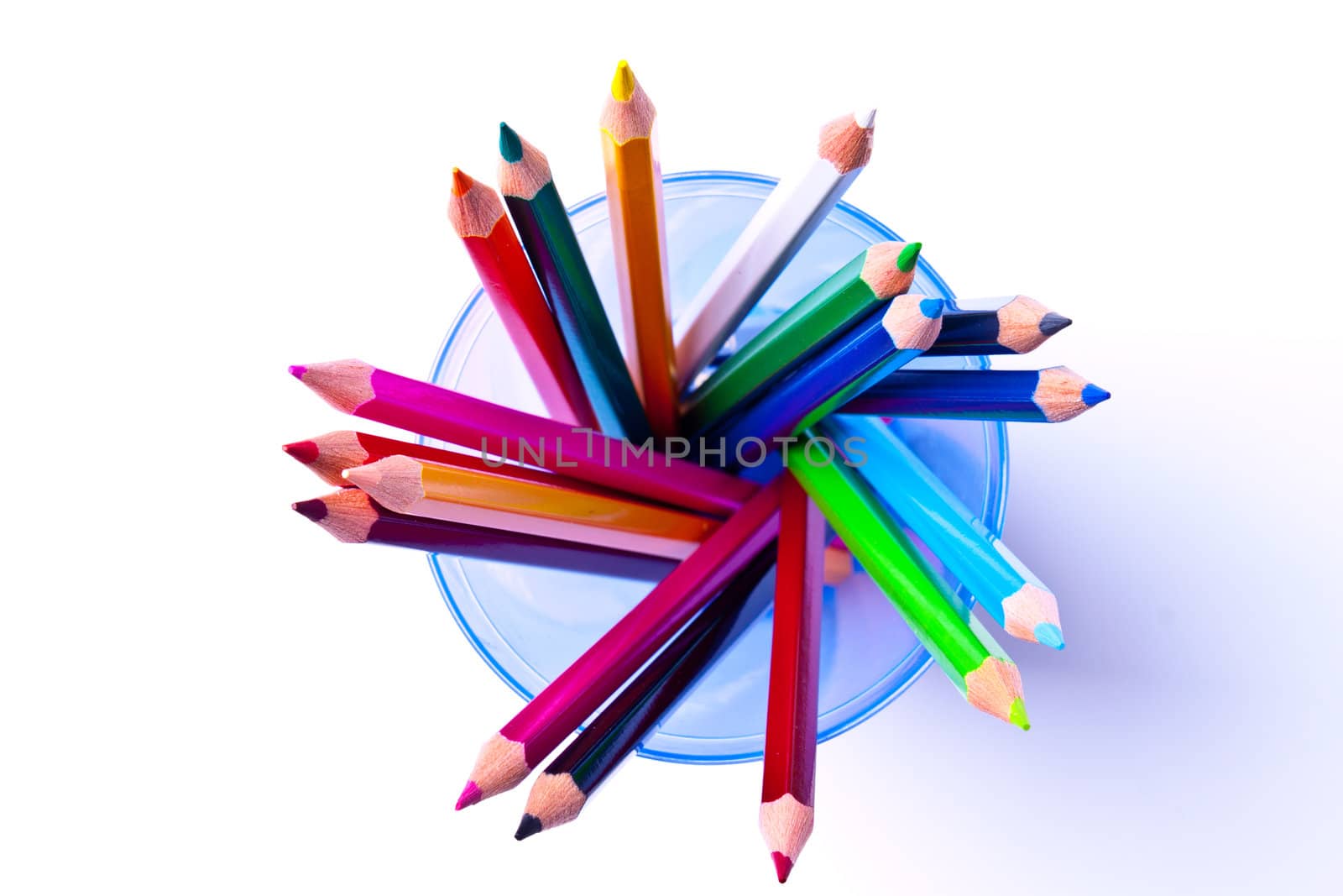 a bunch of colored pencils on a light background