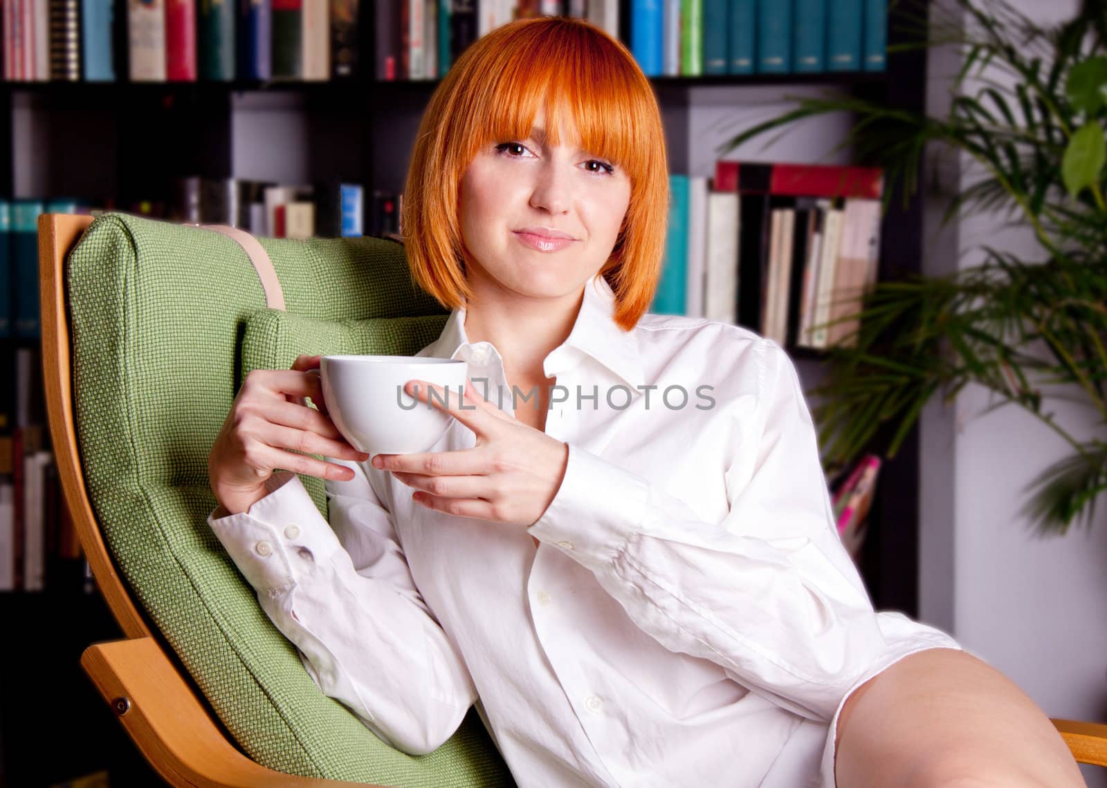 woman with red hair ist sitting on a chair and drinking coffee by juniart