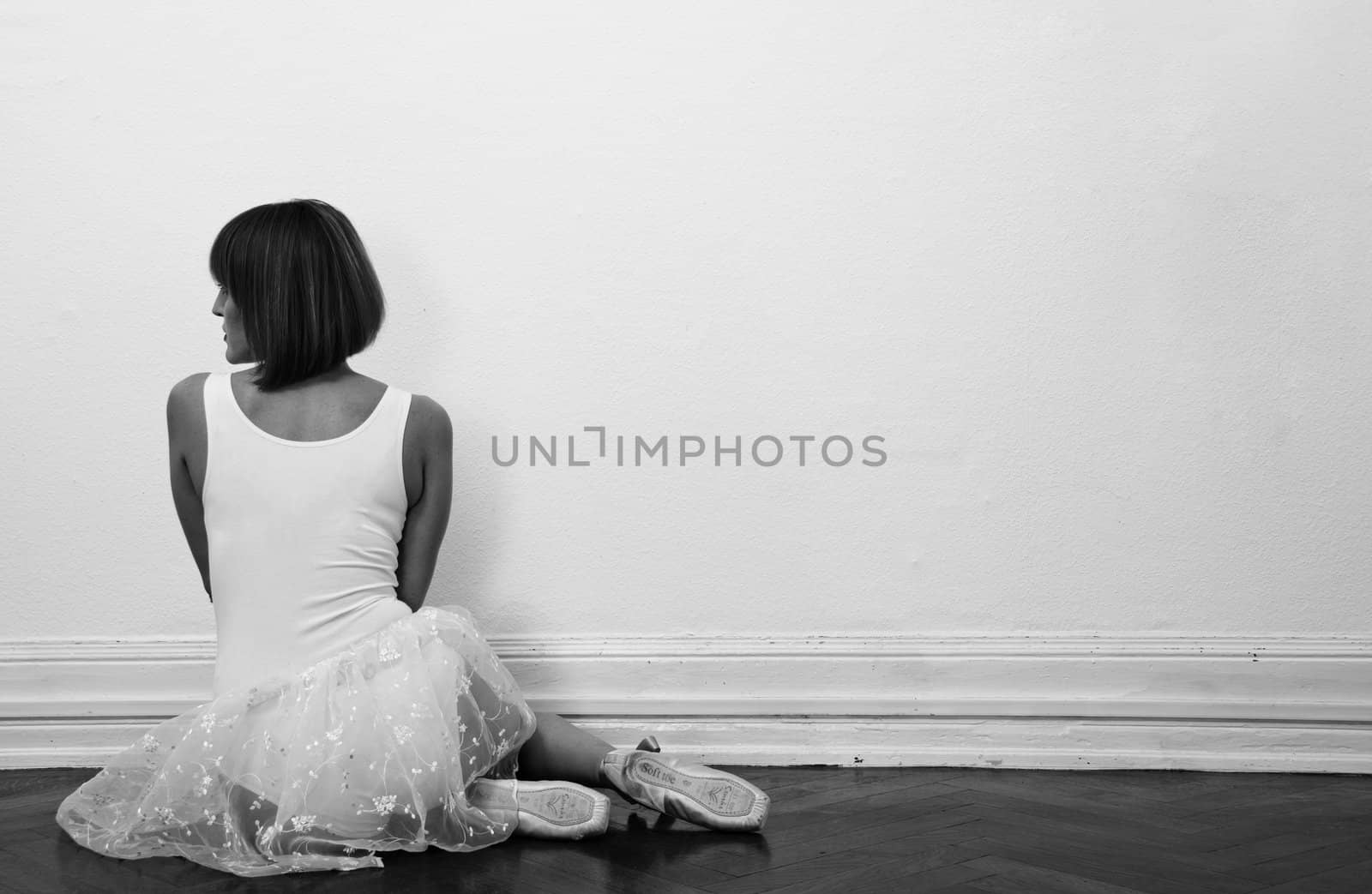 beautiful ballerina is sitting on the floor in black and white by juniart