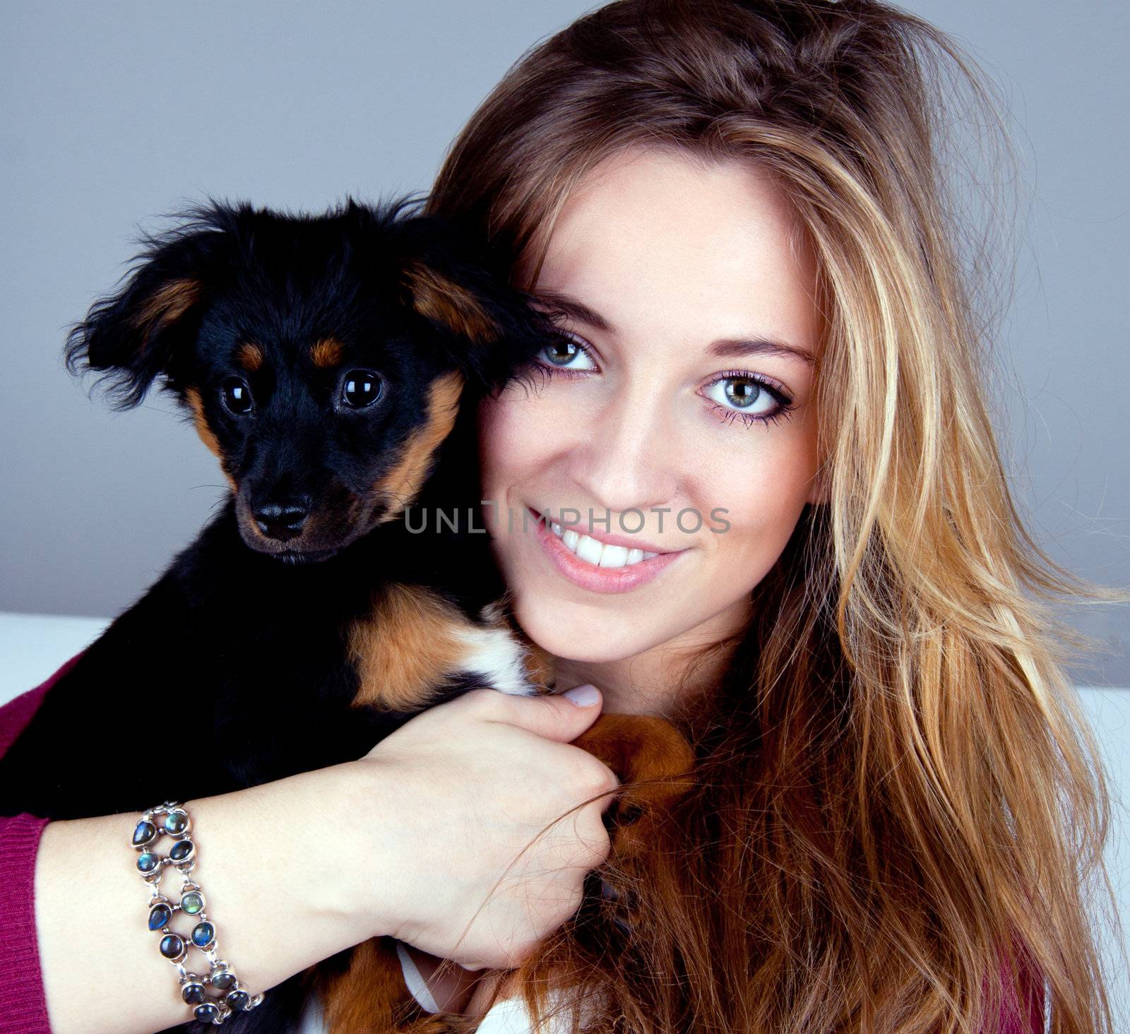 young beatiful girl with a cute little dog having fun