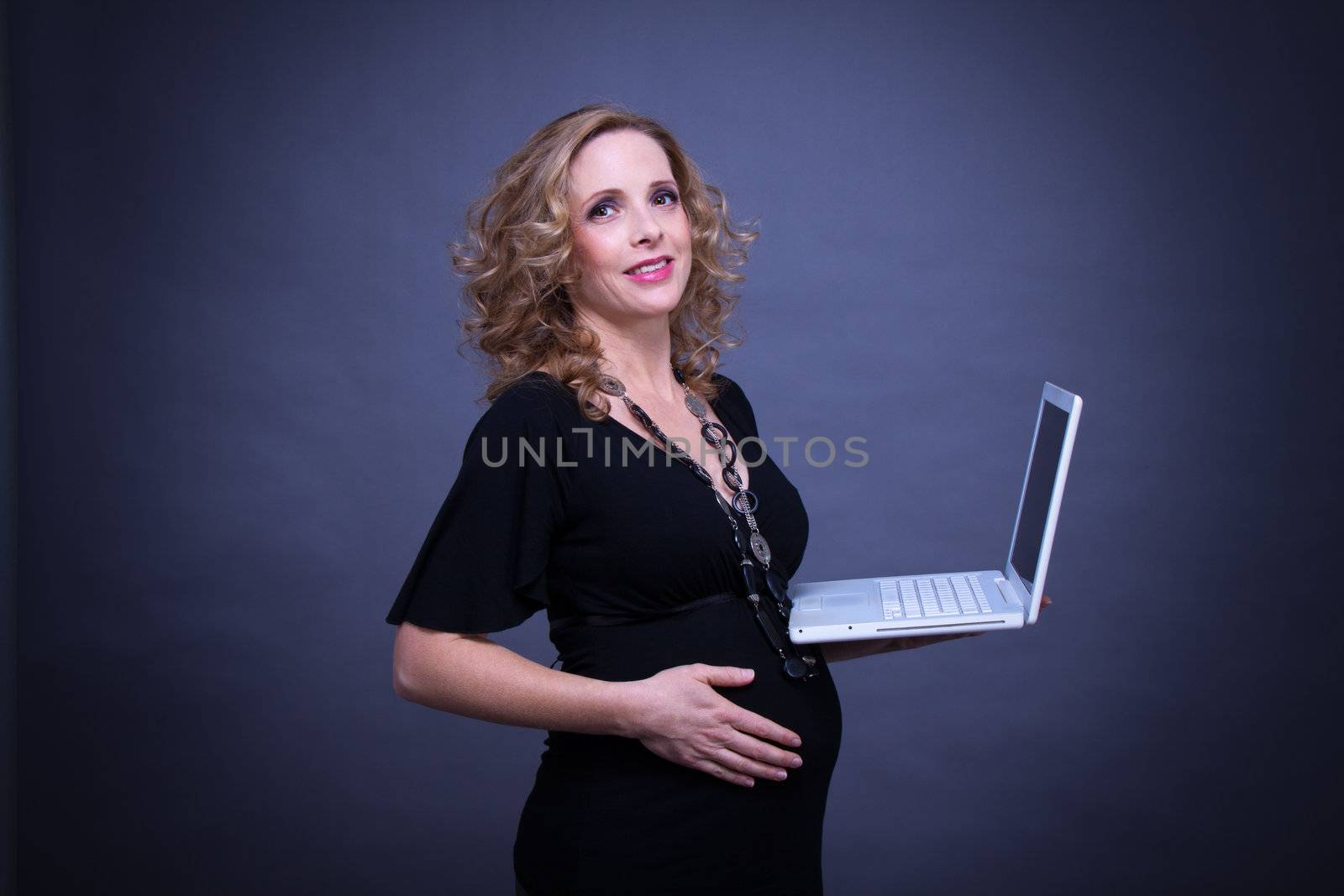 older pregnant woman looks forward to her baby by juniart