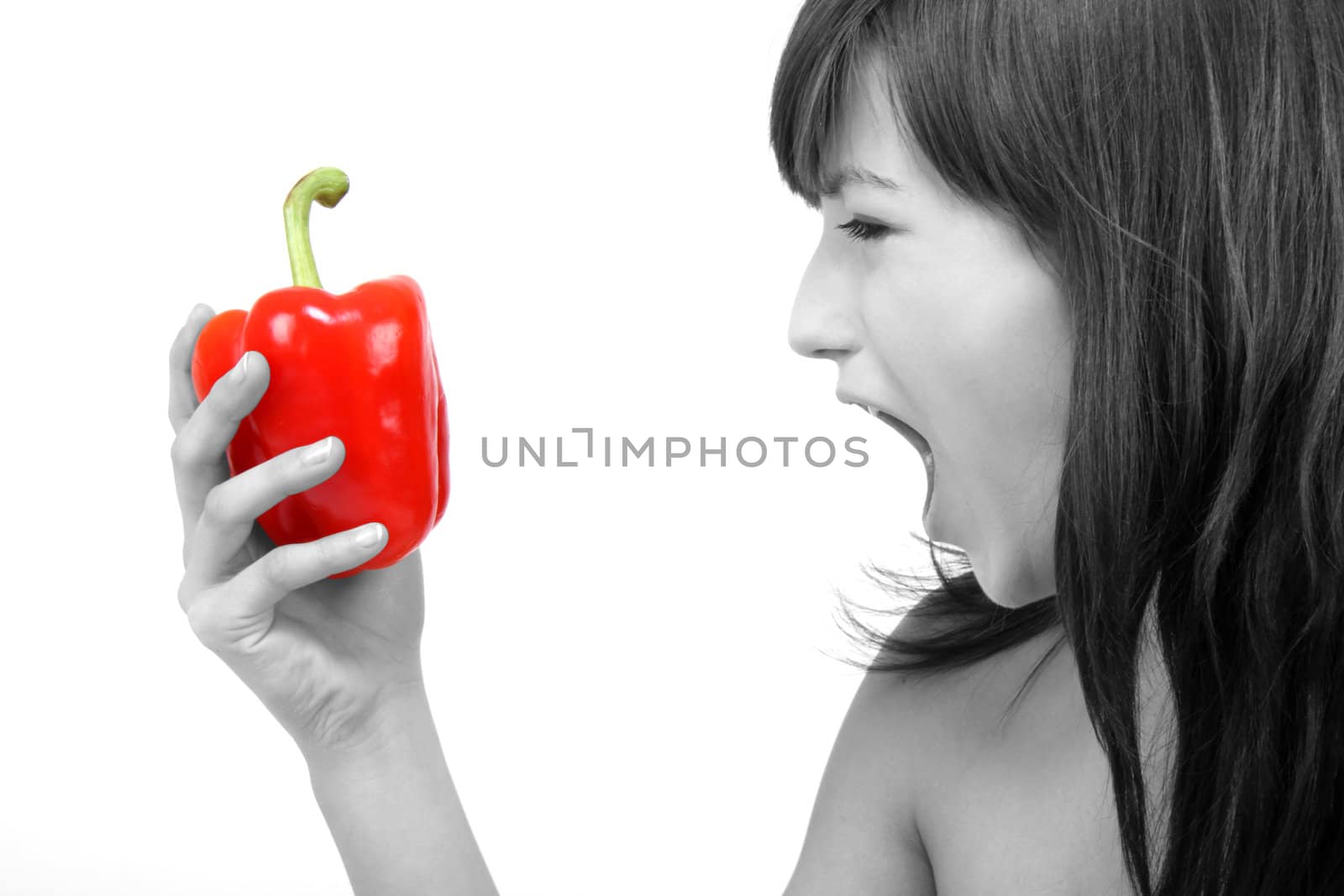 young beautiful girl with a red pepper in her hand
