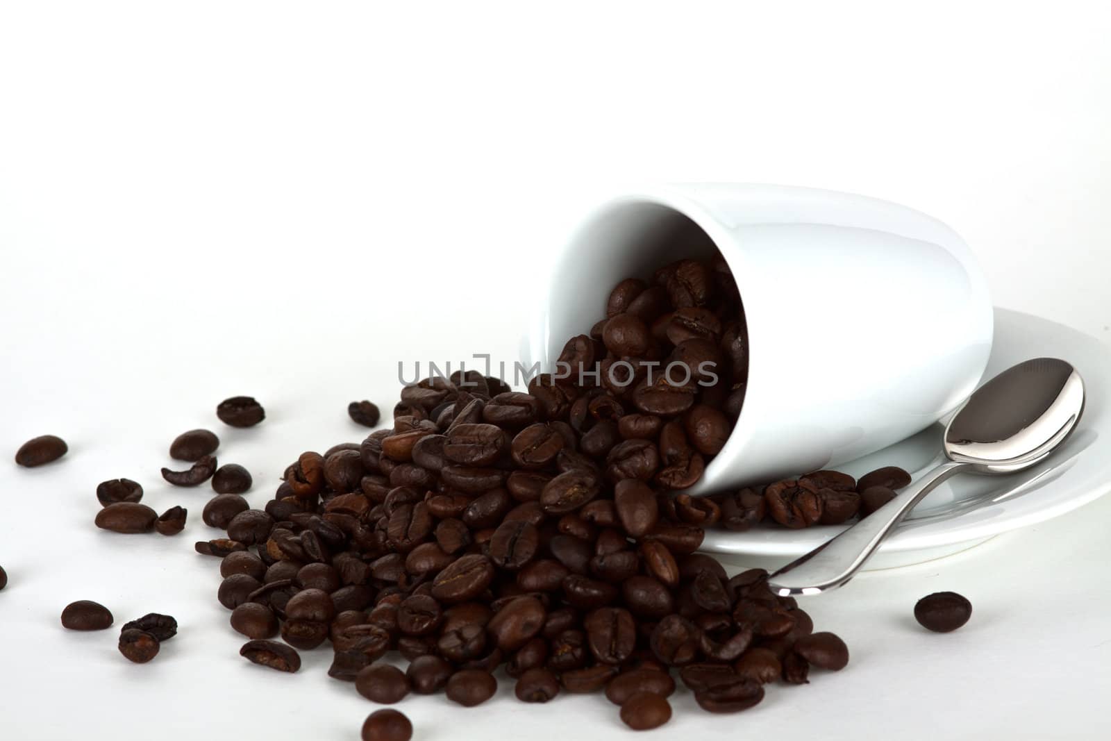 white coffe cup with coffe beans and a silver spoon by juniart