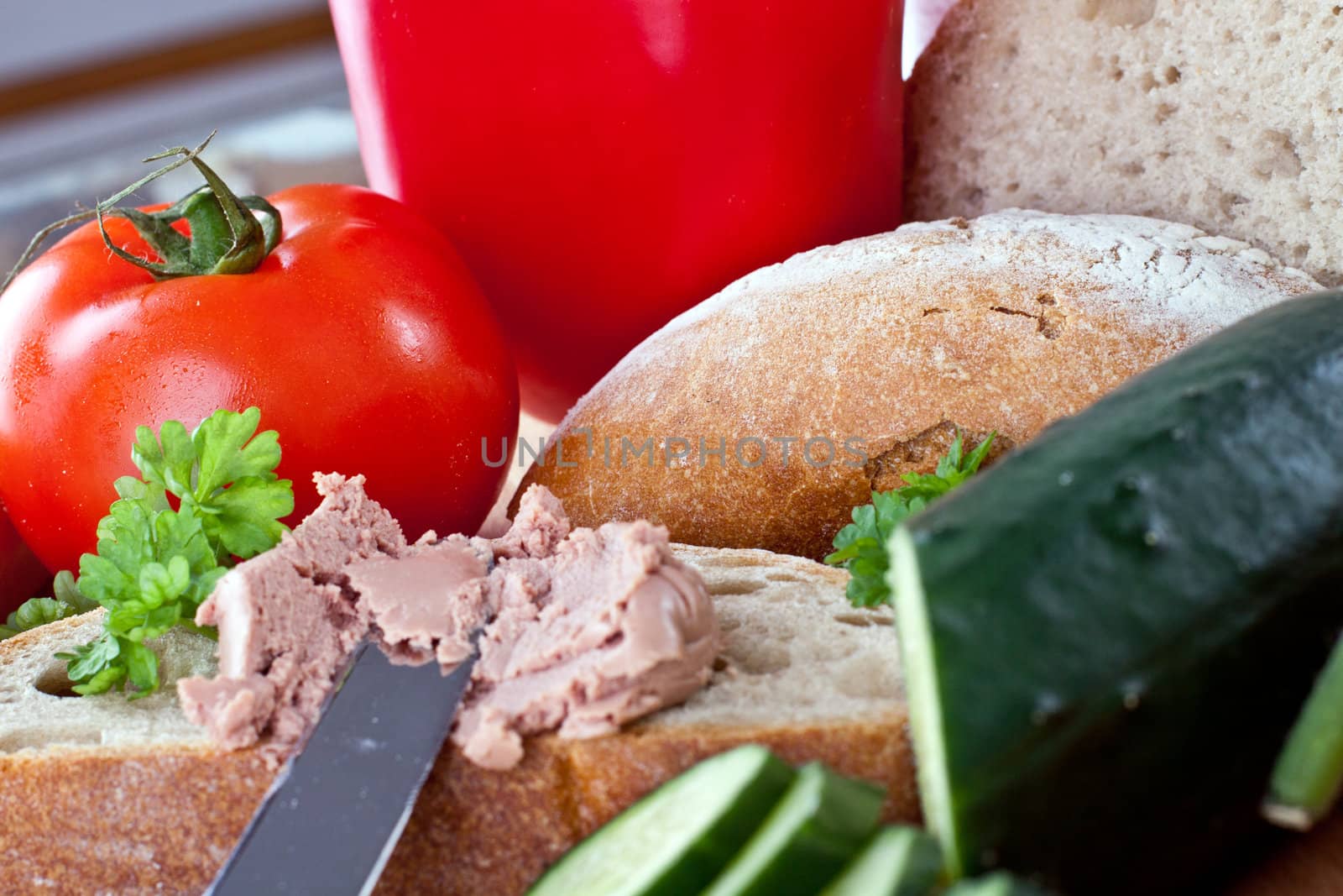 breakfast or lunch with mixed vegetables, sausage and a knife