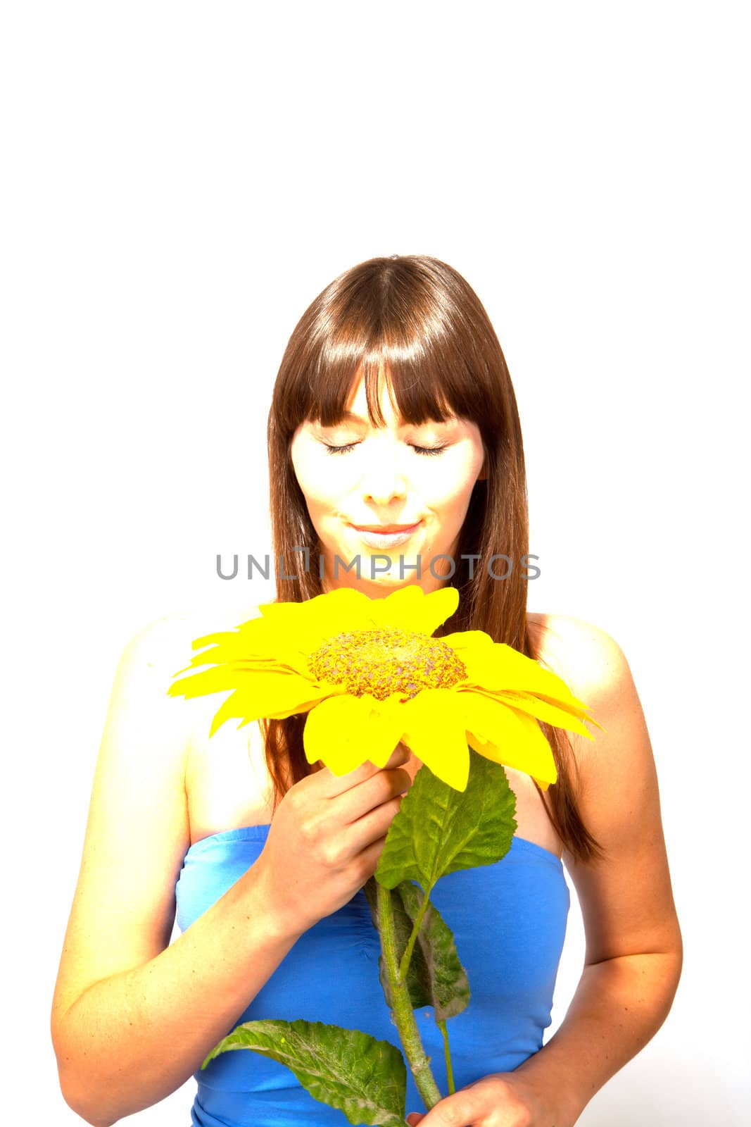 young beautiful brunette woman with a flower happy