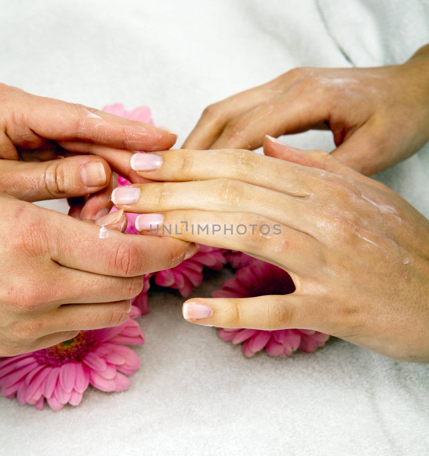 feminin hands with a treatment doing a manicure closeup by juniart