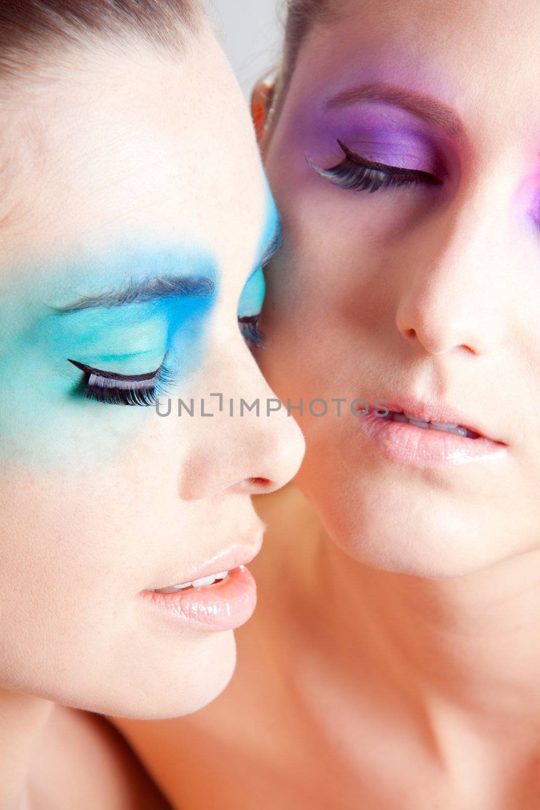 young beautiful woman with an extreme colorfull make up portrait by juniart