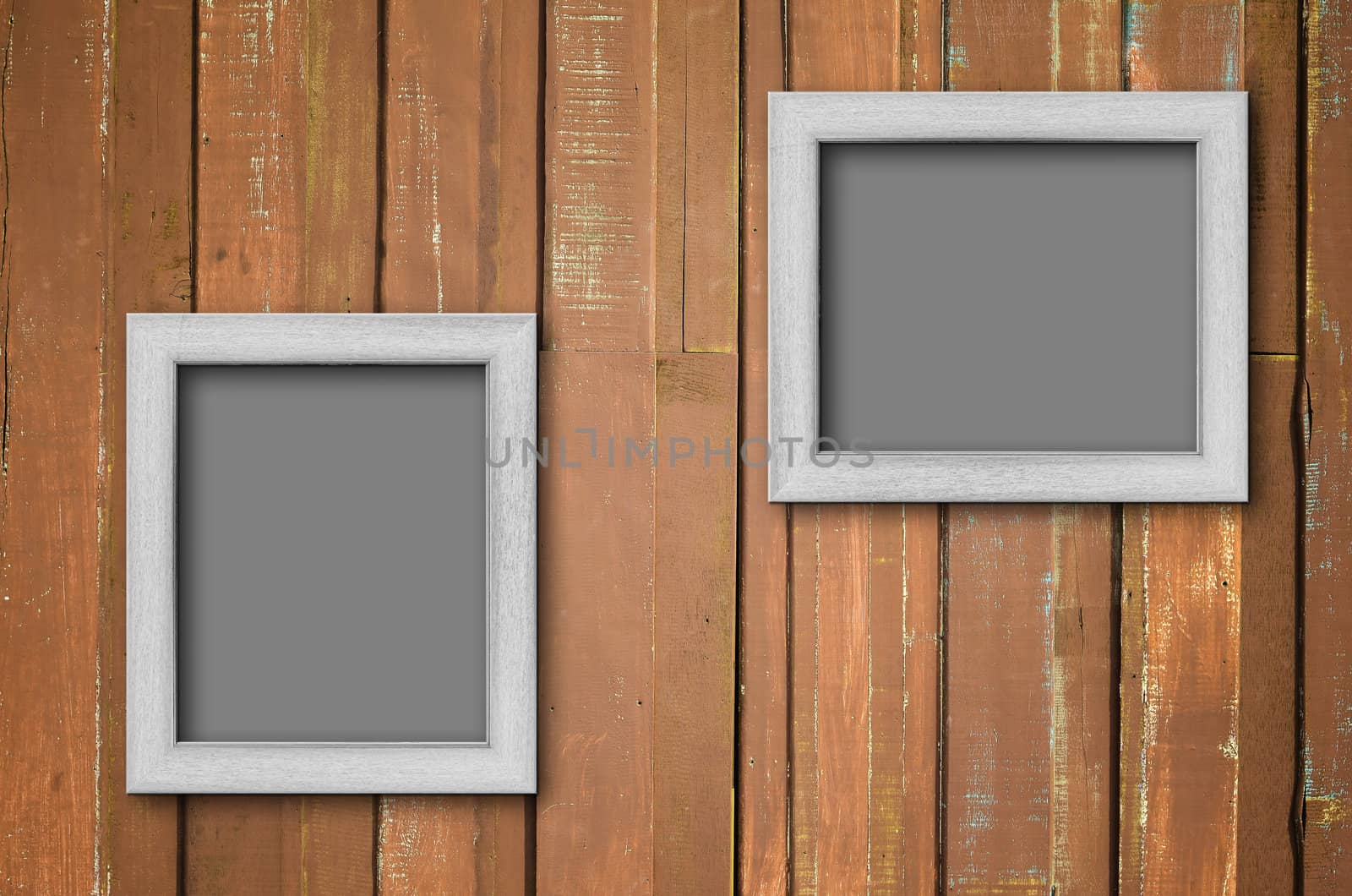 White wood picture frame on Brown wall by nuttakit