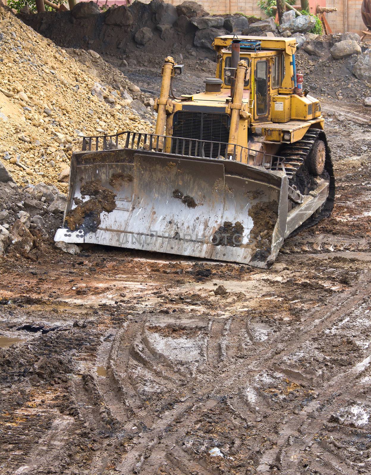 Bulldozer machine doing earthmoving work in mining