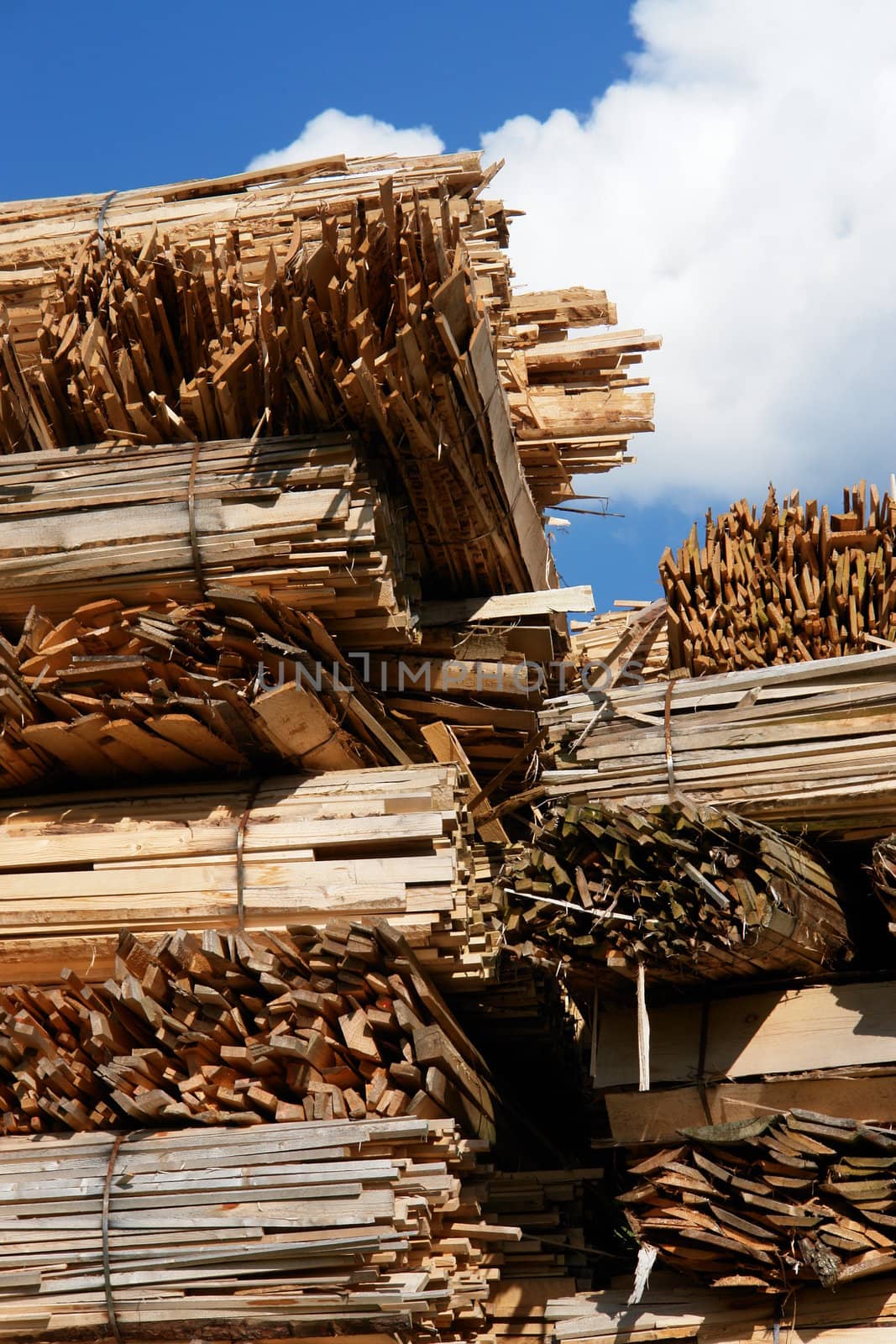 Close-up of a woodstack against a very blue sky