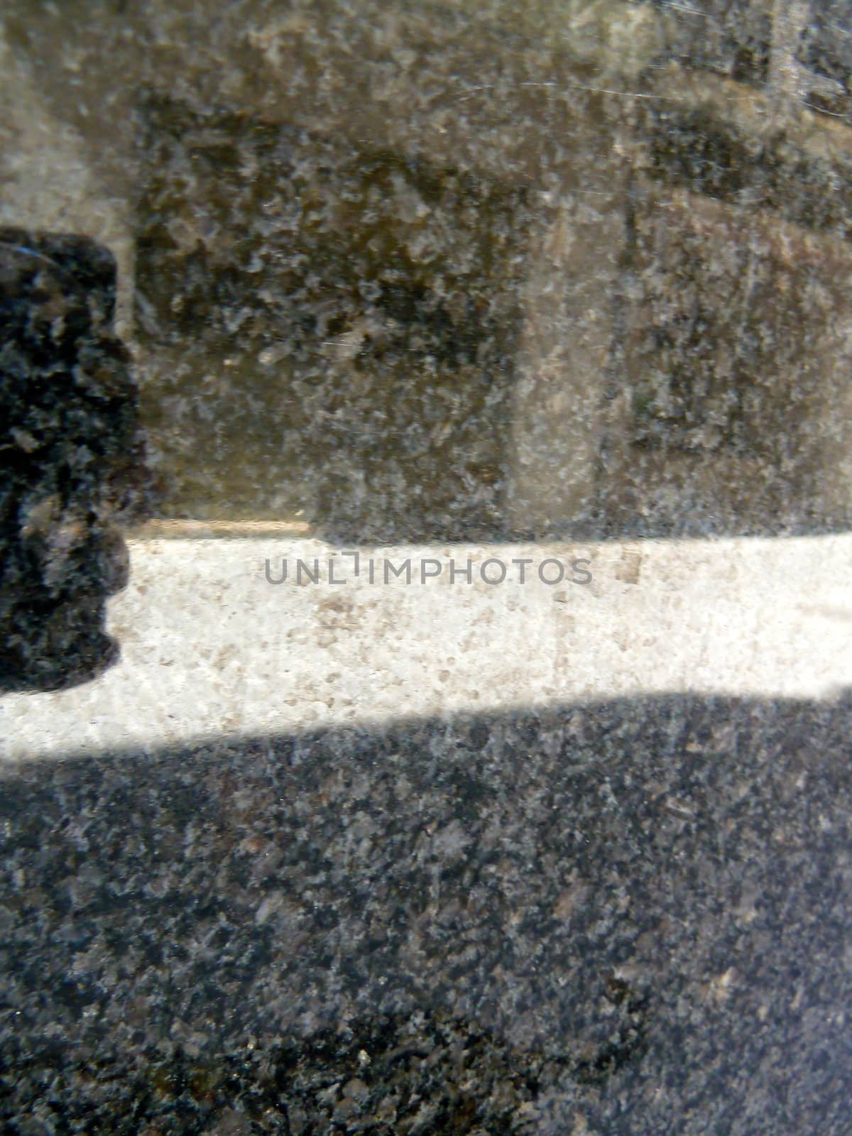 reflection of a street in dusty stone