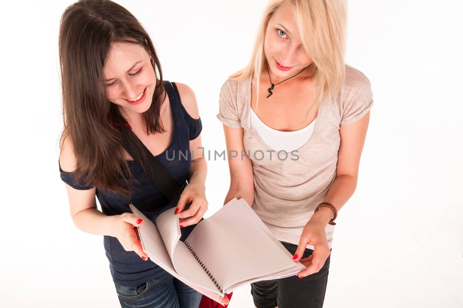 Two beautiful student girls getting ready for school isolated