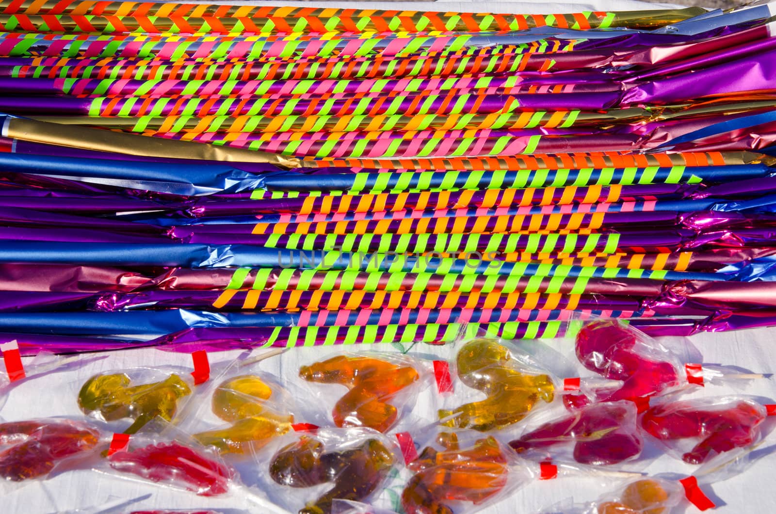 Long and delicious candies with colorful papers by sauletas