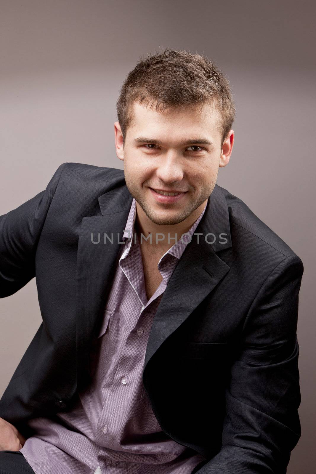 portrait of young man over gray background